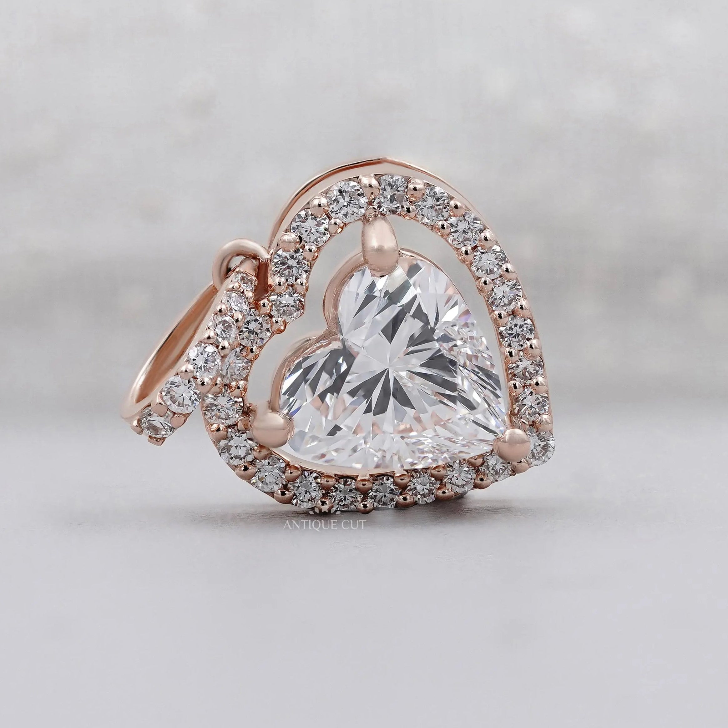 Rose gold heart-shaped diamond pendant with halo