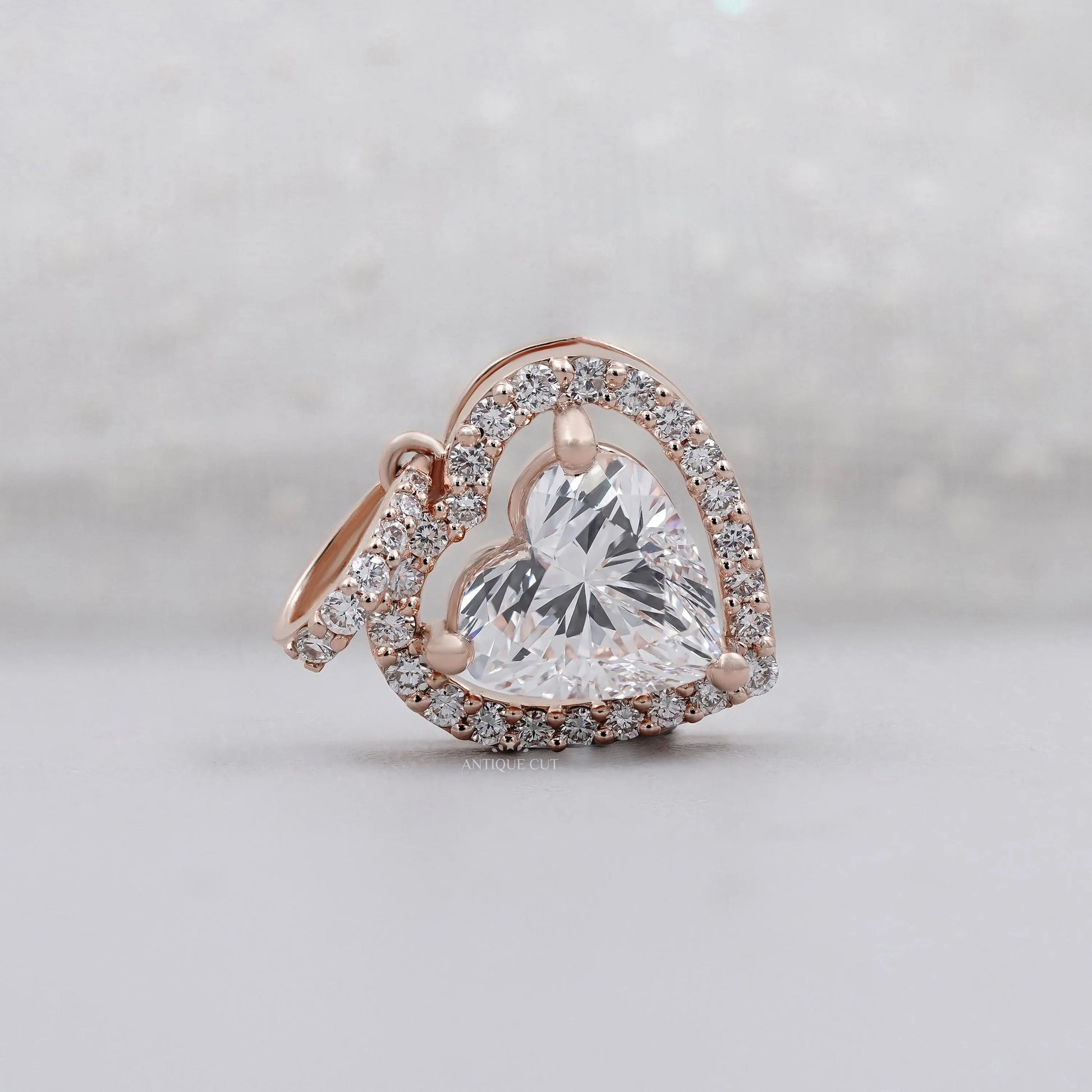 Rose gold heart-shaped diamond pendant with halo