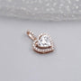 Elegant rose gold heart pendant with halo diamonds