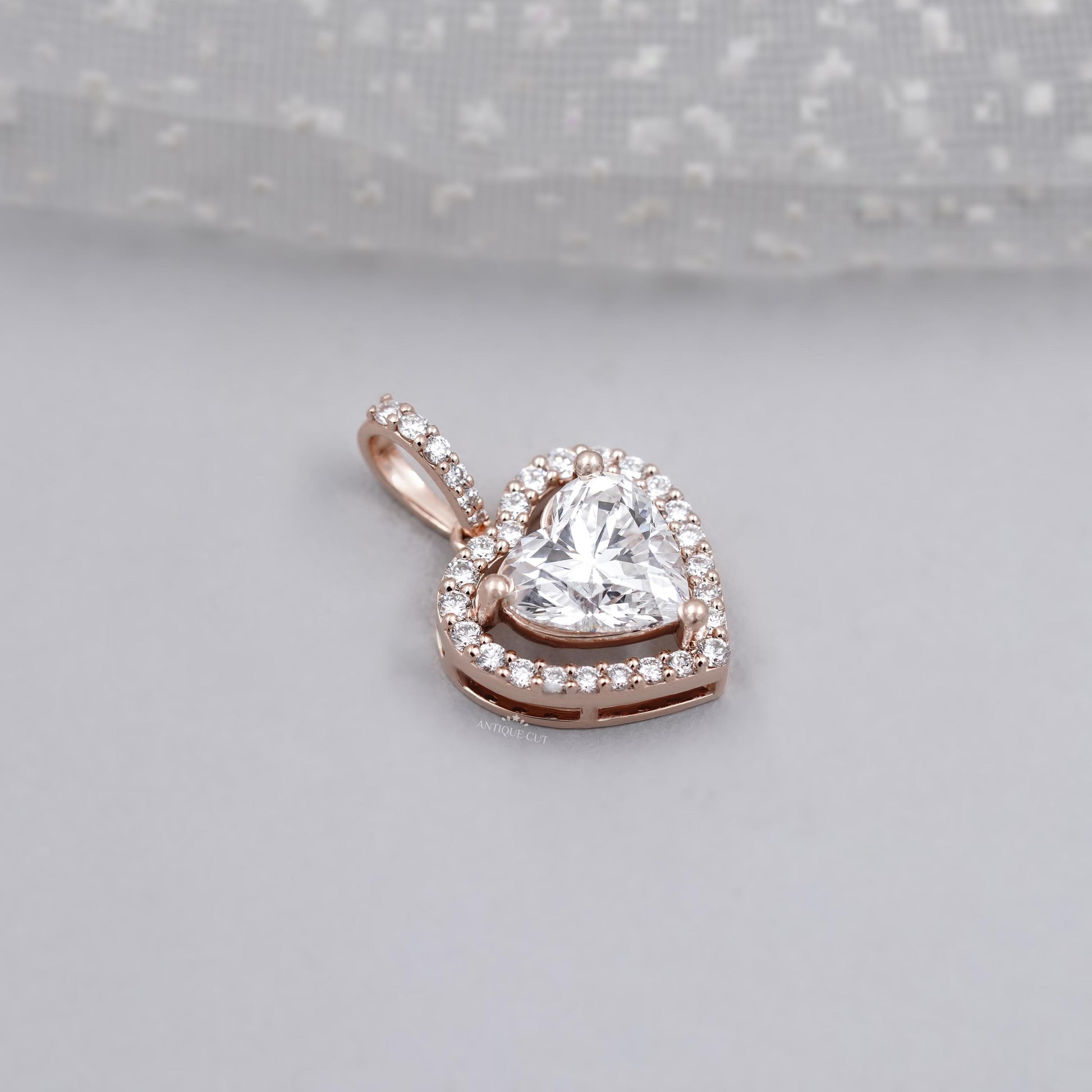 Elegant rose gold heart pendant with halo diamonds