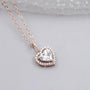 Heart-shaped diamond halo pendant by Antiquecut