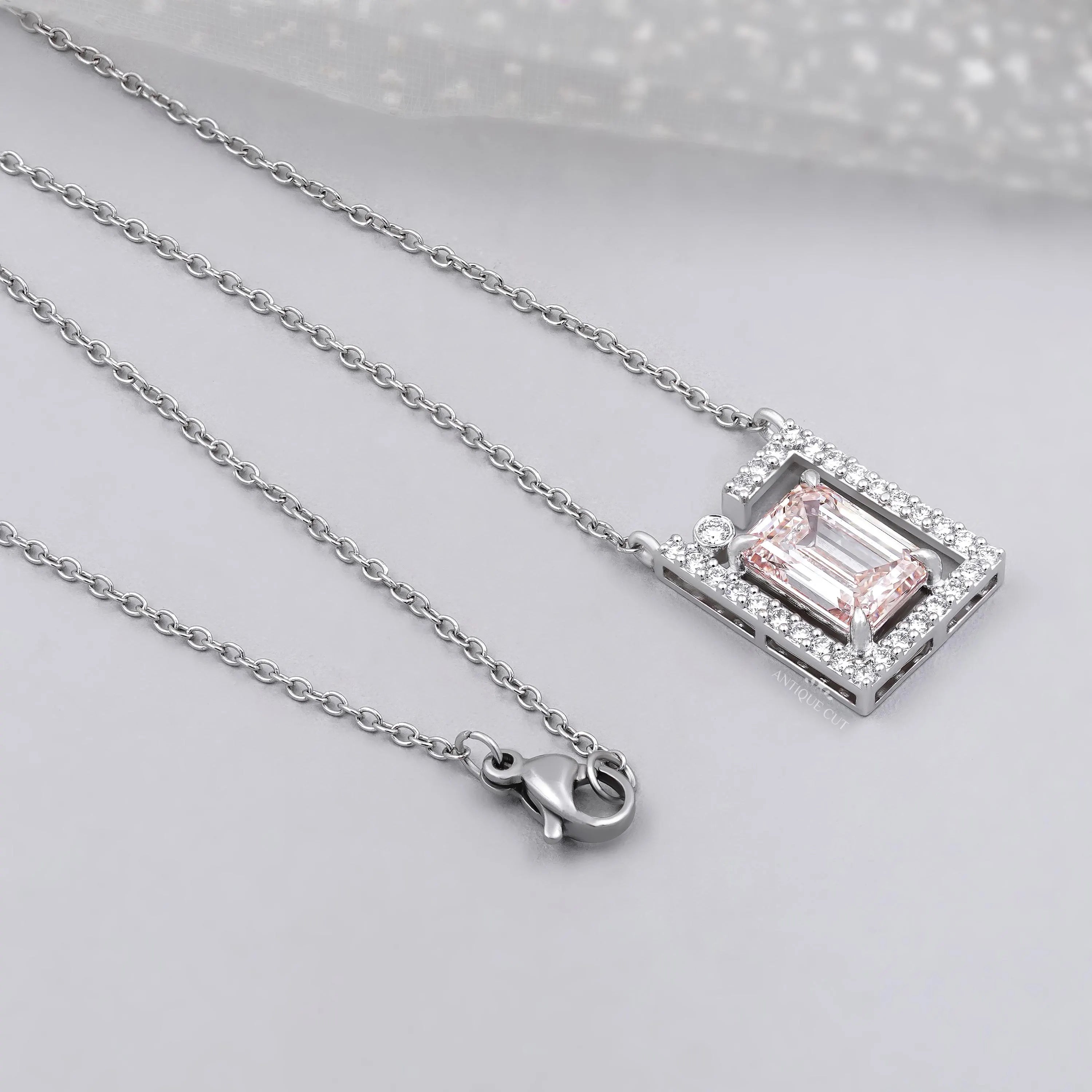 Antiquecut emerald frame diamond pendant