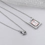 Antiquecut emerald frame diamond pendant