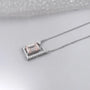 Elegant emerald modern frame pendant with diamonds