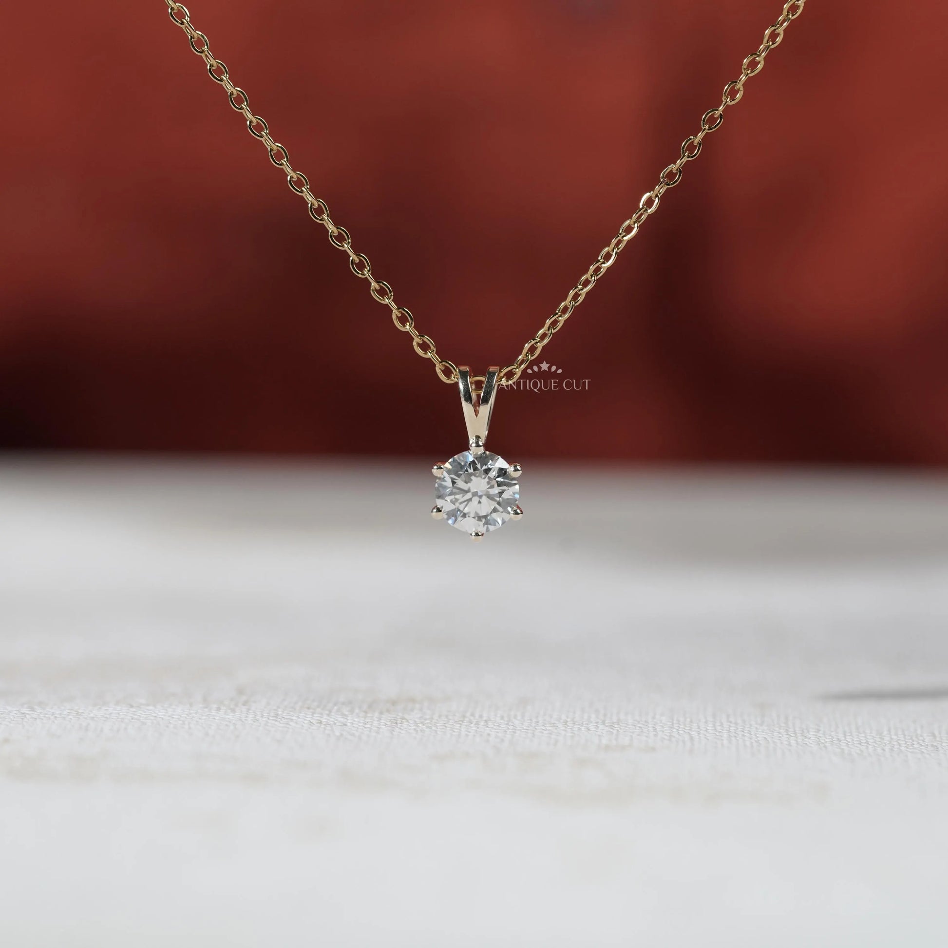 Modern two tone solitaire diamond pendant
