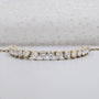 Elegant round diamond curved bar pendant in yellow gold