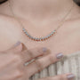 Yellow gold curved diamond pendant necklace