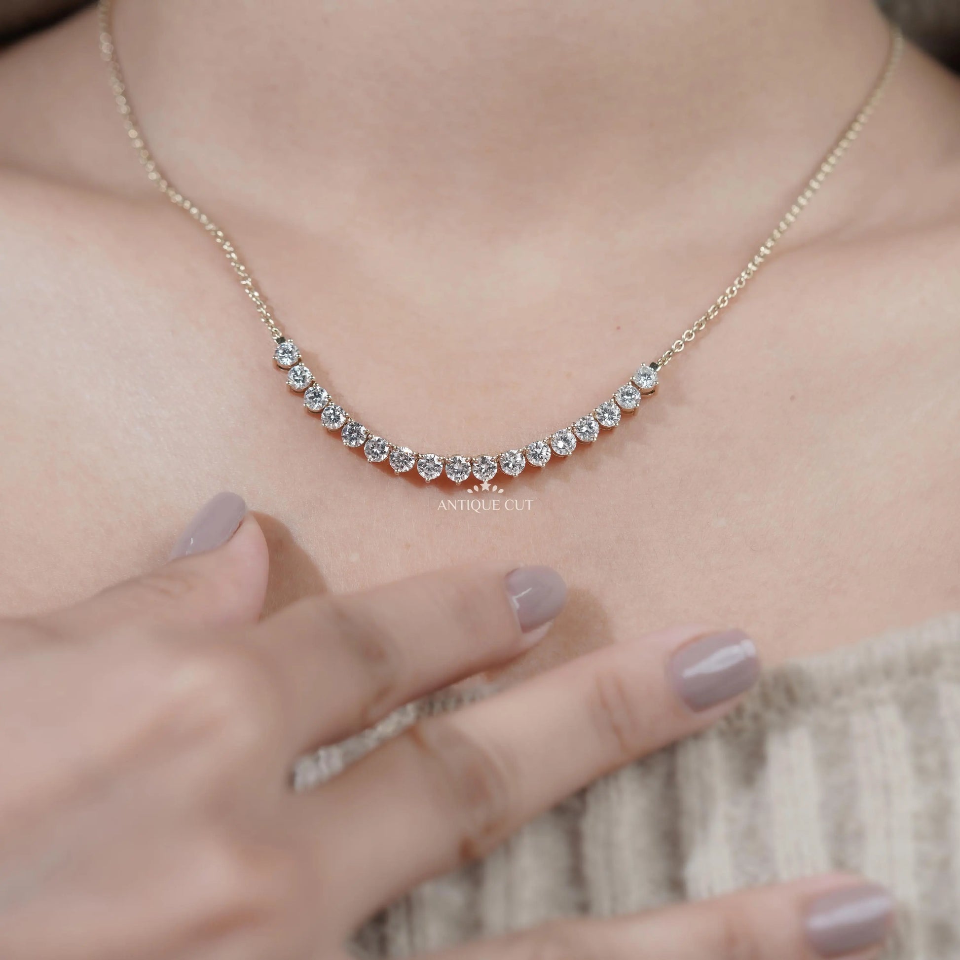 Yellow gold curved diamond pendant necklace