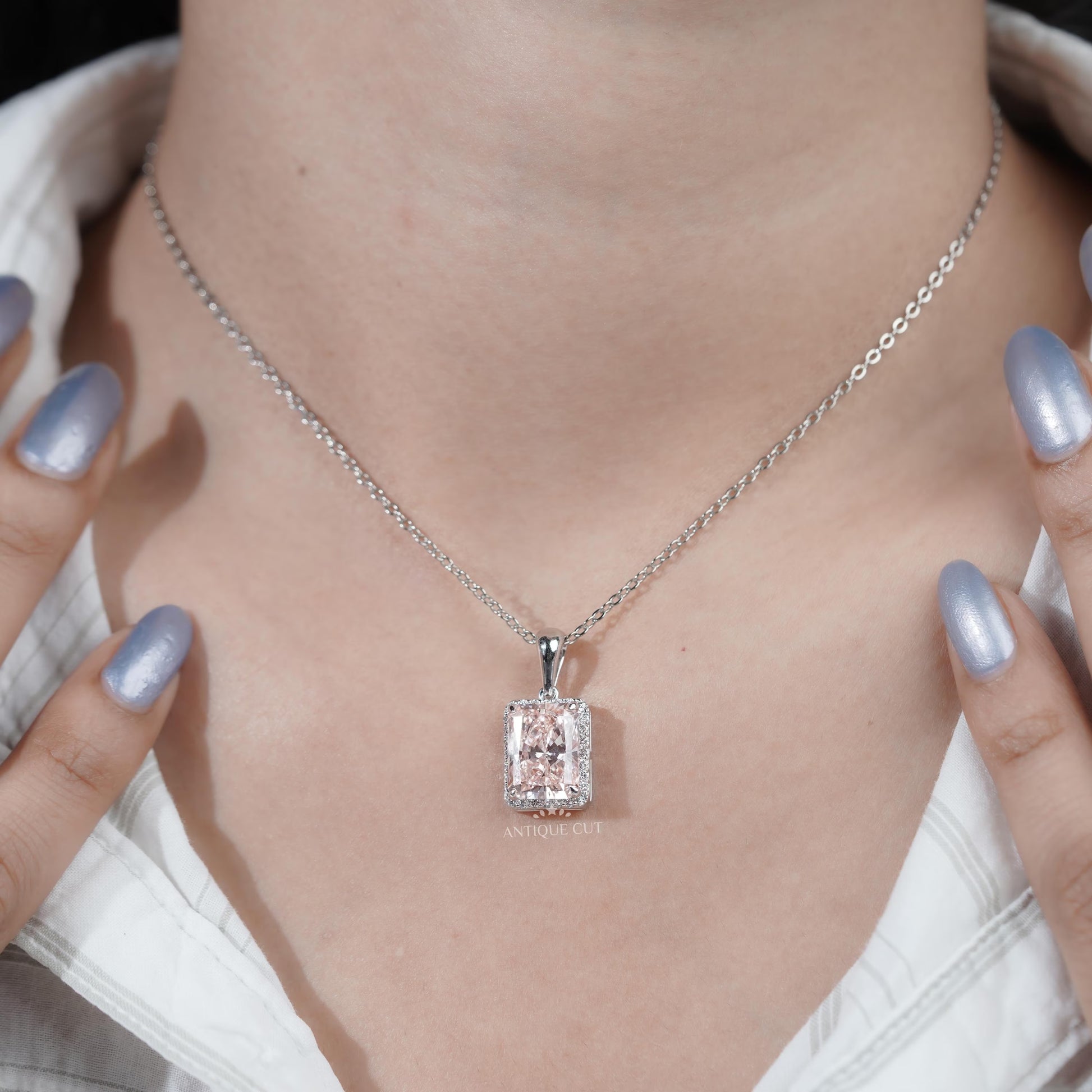 Halo pendant with radiant cut pink diamond