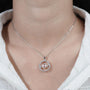 Asscher cut diamond pendant with swirl frame