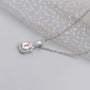 Lab grown diamond emerald halo pendant
