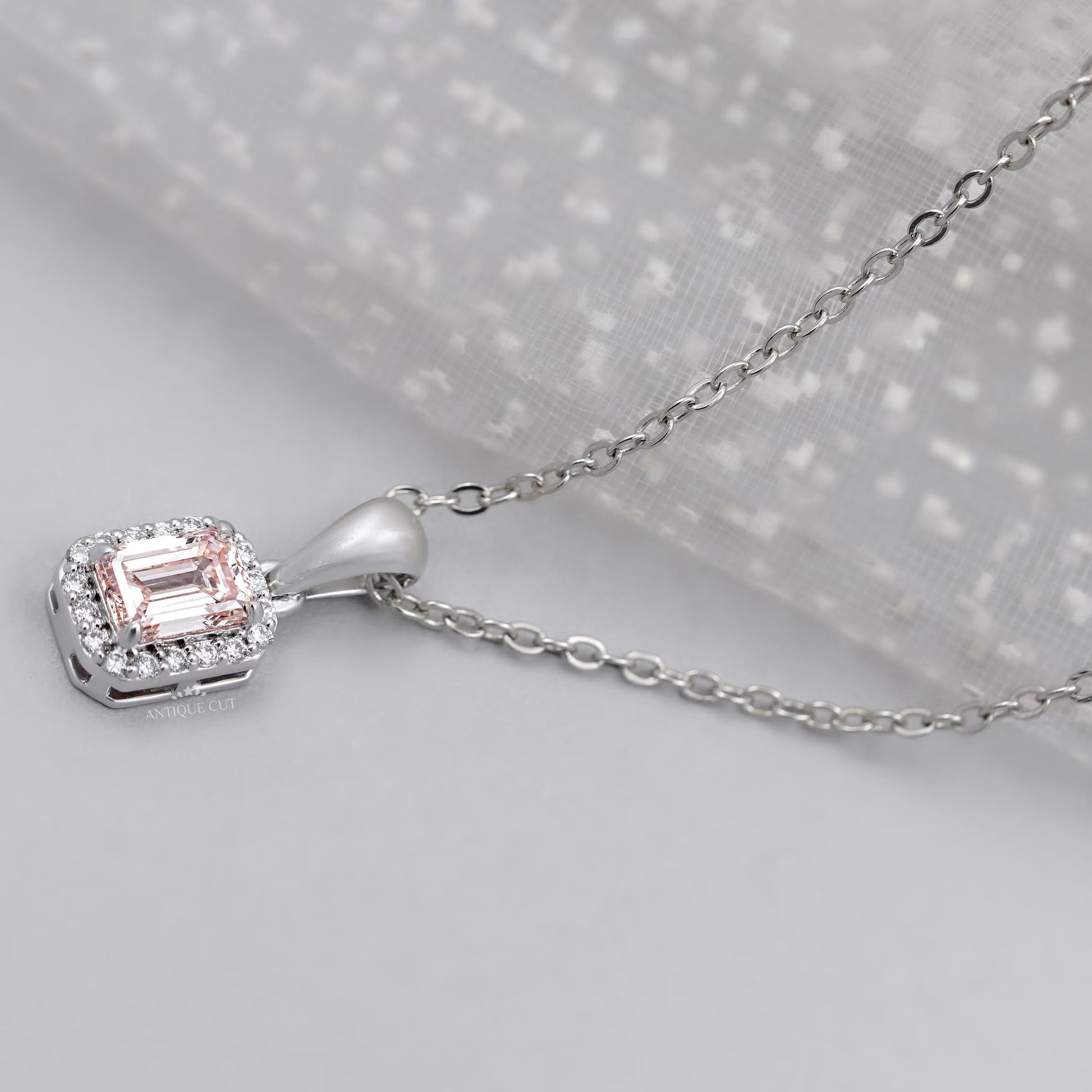 Lab grown emerald cut diamond pendant with halo setting