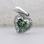 Green heart shaped diamond pendant with halo