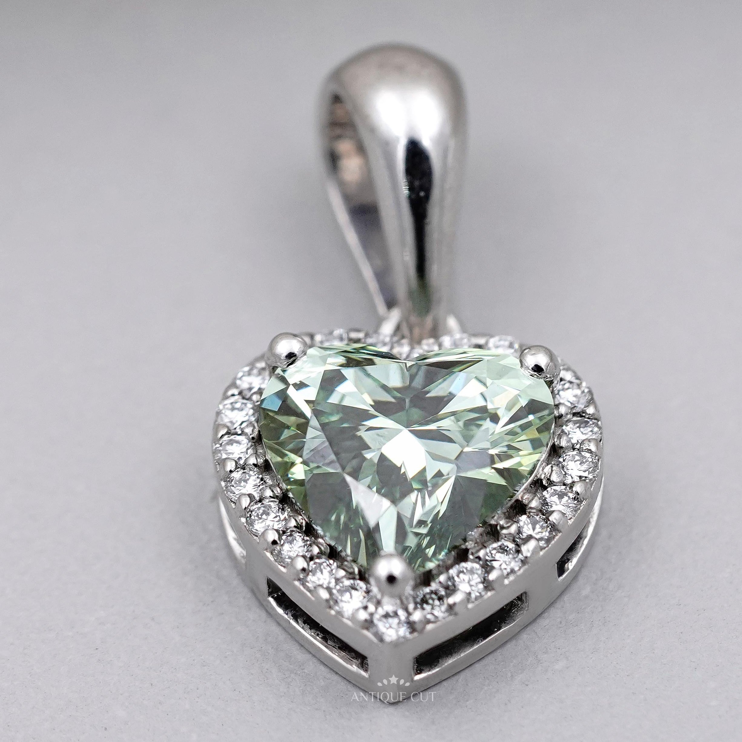 Elegant green heart diamond halo pendant in white gold