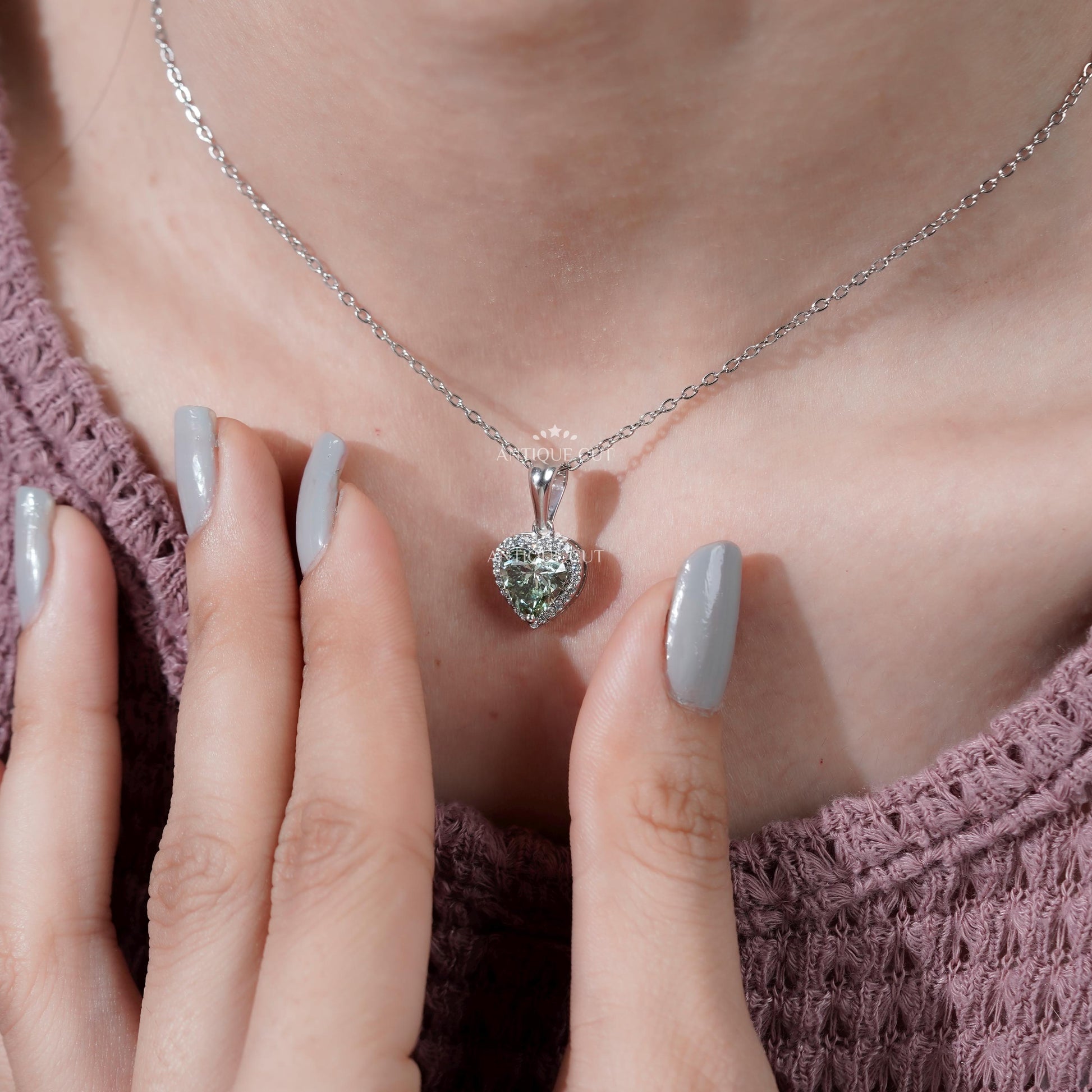 Modern halo pendant with green diamond