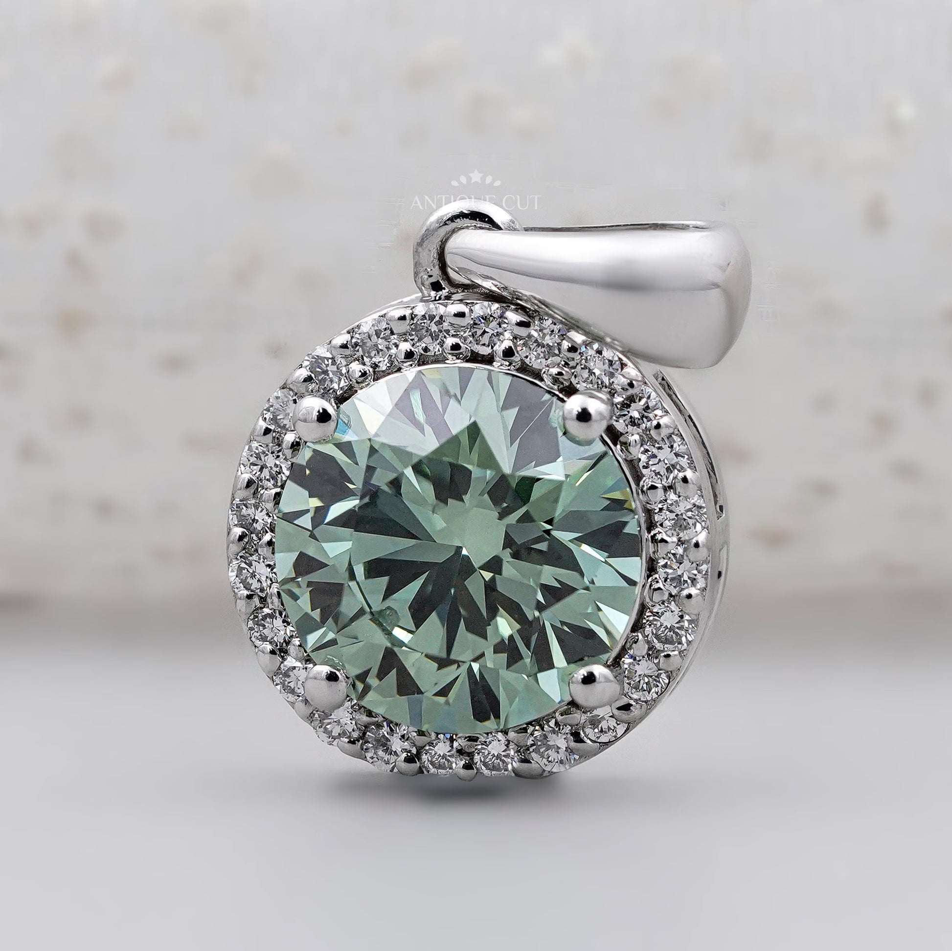 Classic round halo green diamond pendant in white gold