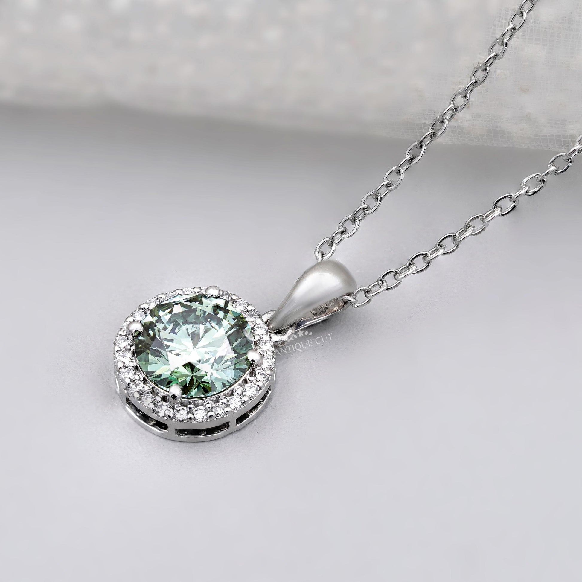 Antiquecut round green diamond pendant