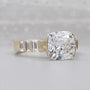 Cushion cut East West engagement ring with half bezel setting