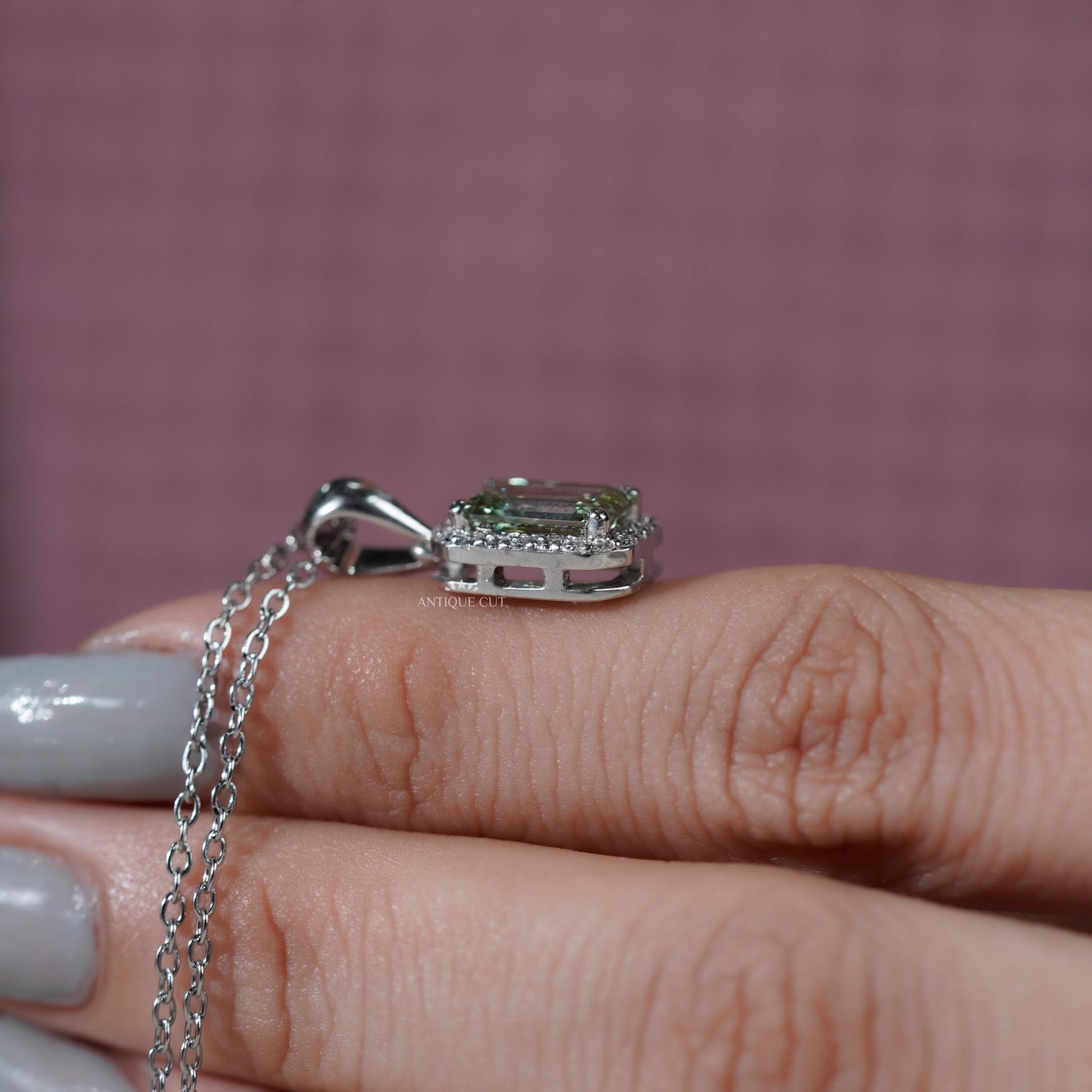 Antiquecut emerald halo pendant