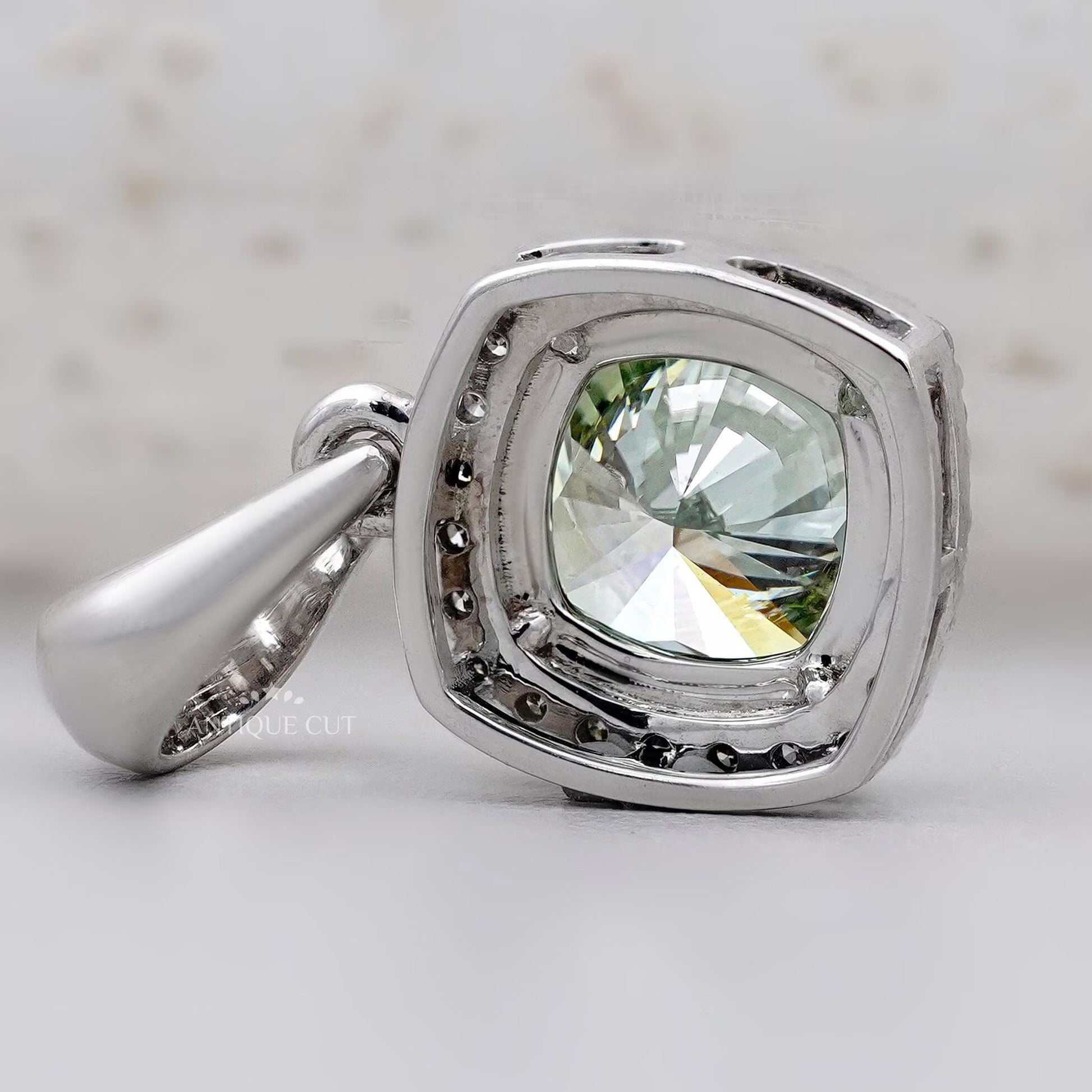 Green cushion diamond pendant necklace with halo design