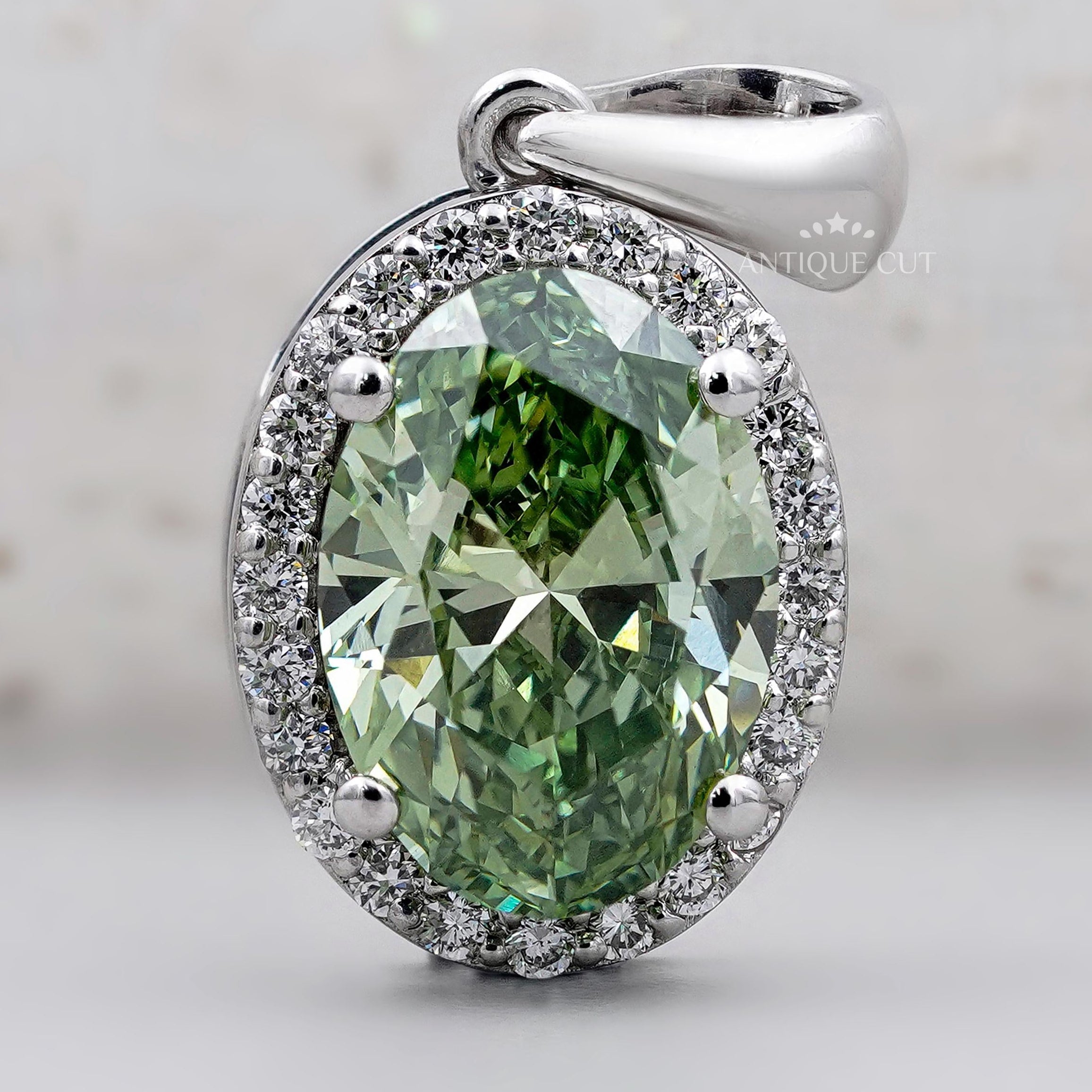 Elegant oval green diamond pendant in white gold