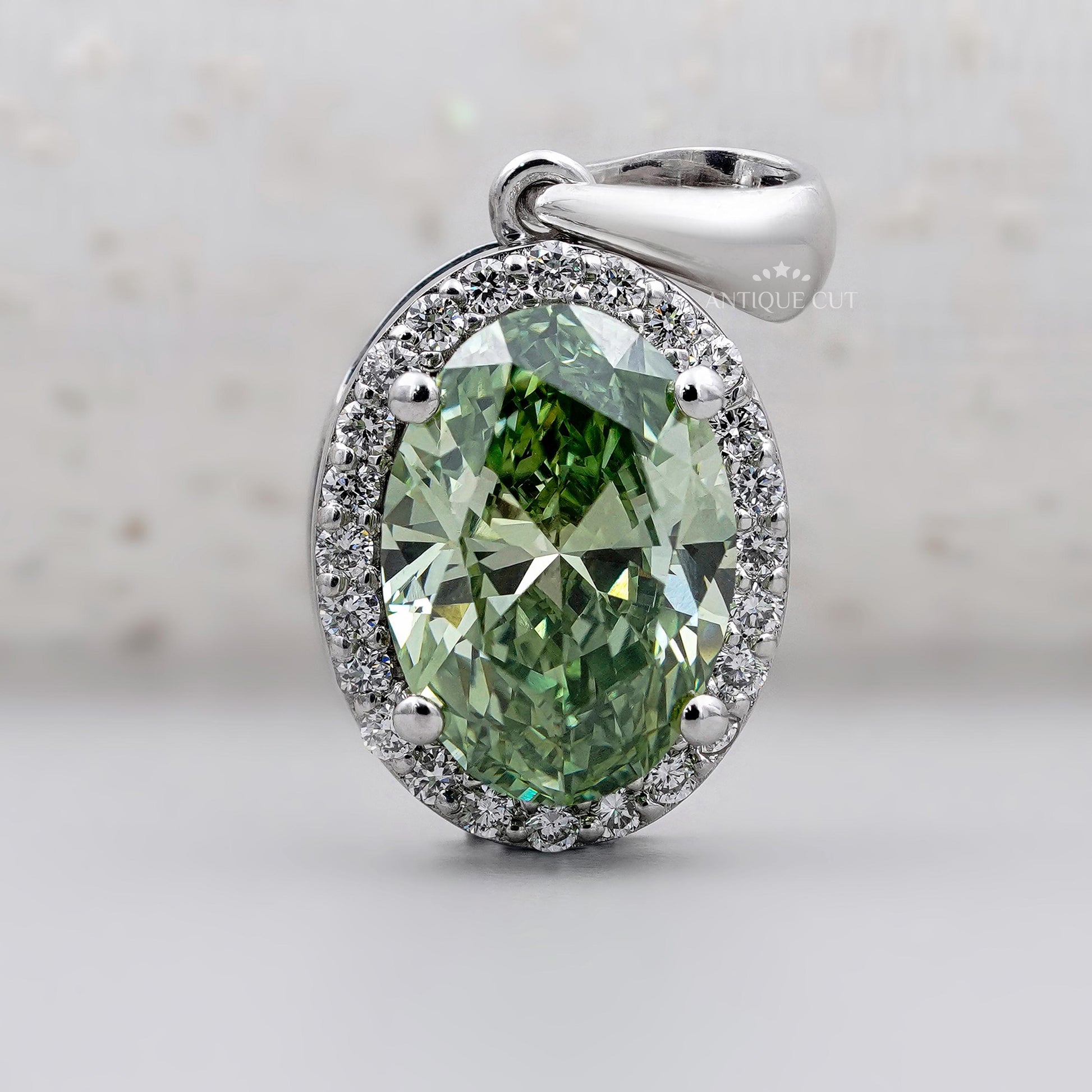 Elegant oval green diamond pendant in white gold