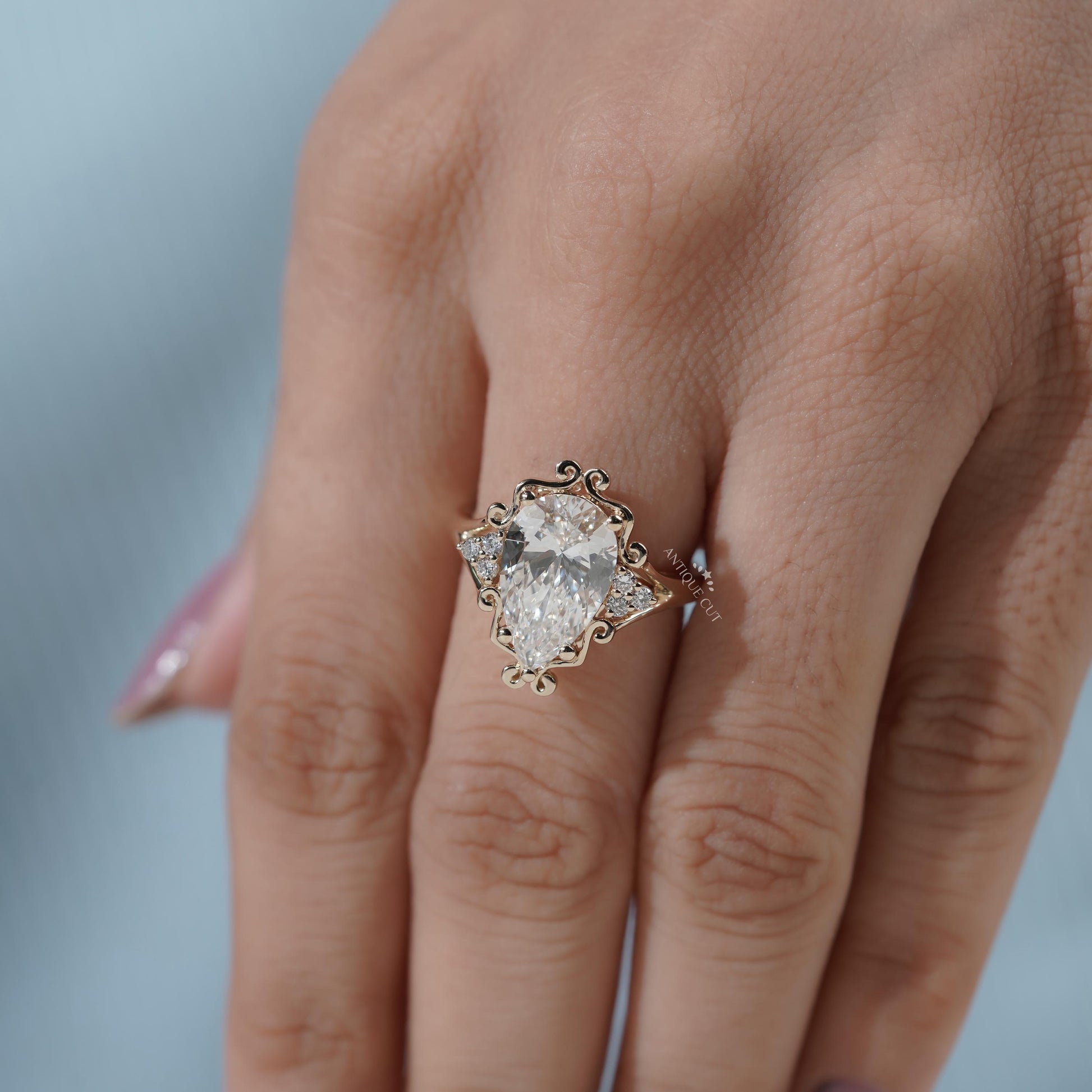 Unique pear diamond proposal ring with yellow gold band