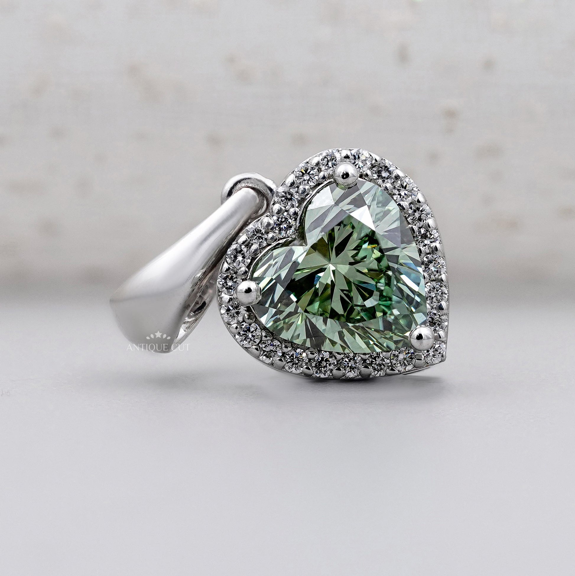 White gold green diamond halo necklace