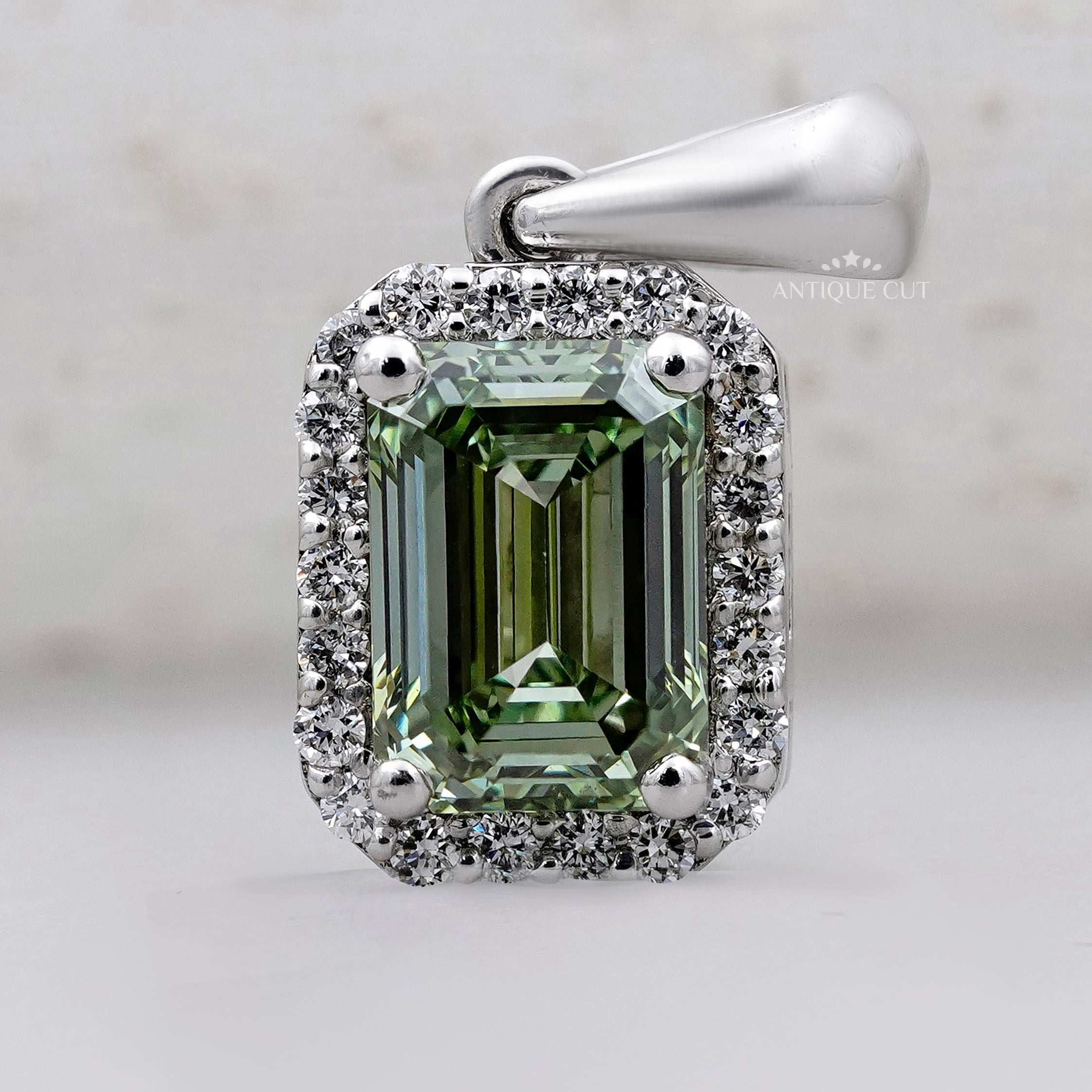 Royal emerald halo pendant in white gold