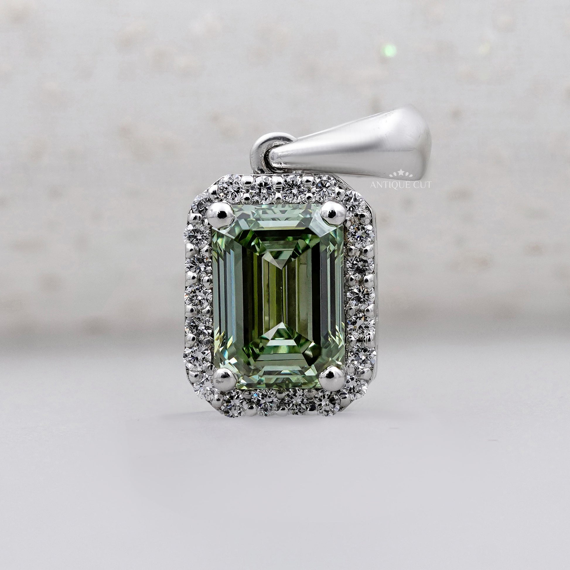 Royal emerald halo pendant in white gold