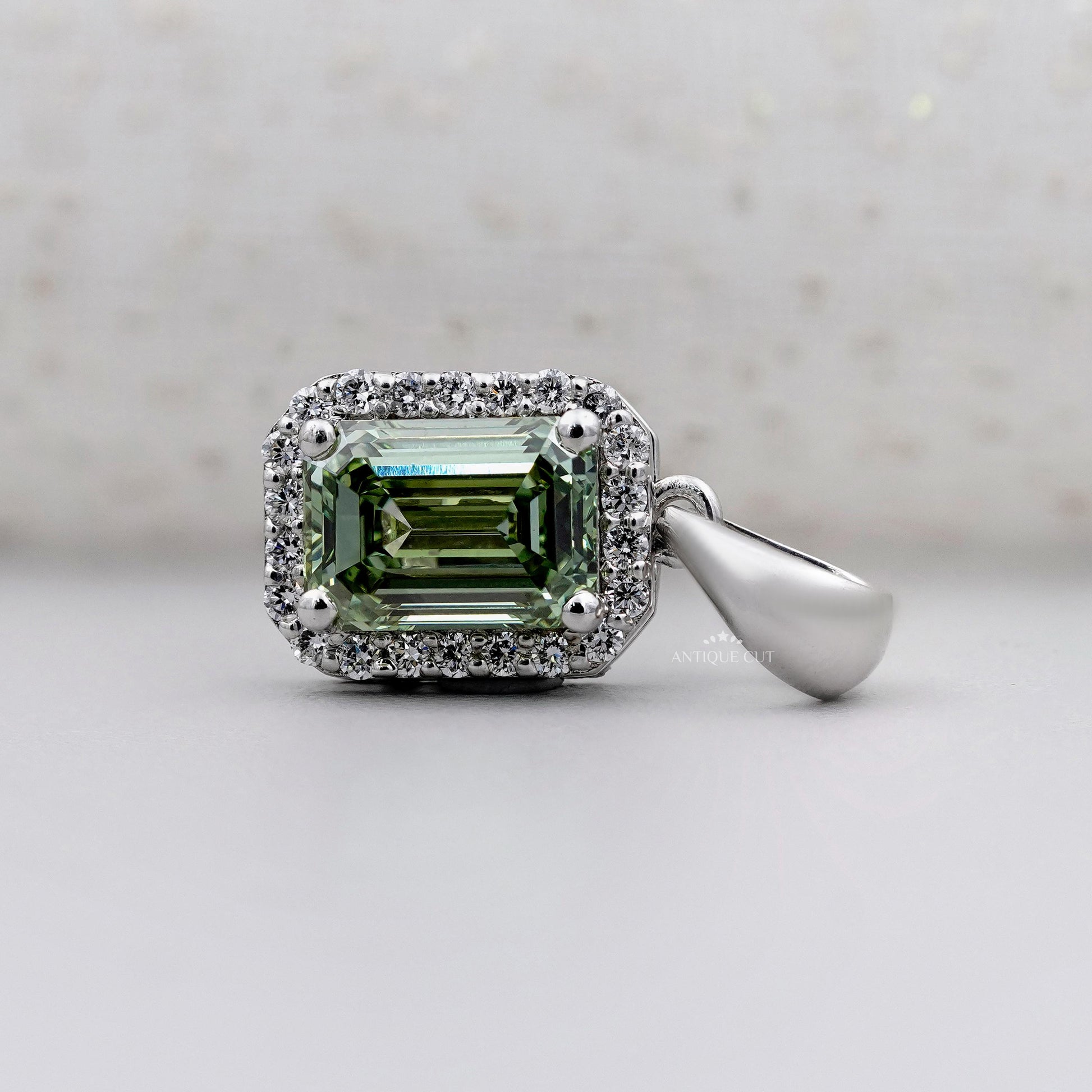 White gold emerald diamond pendant