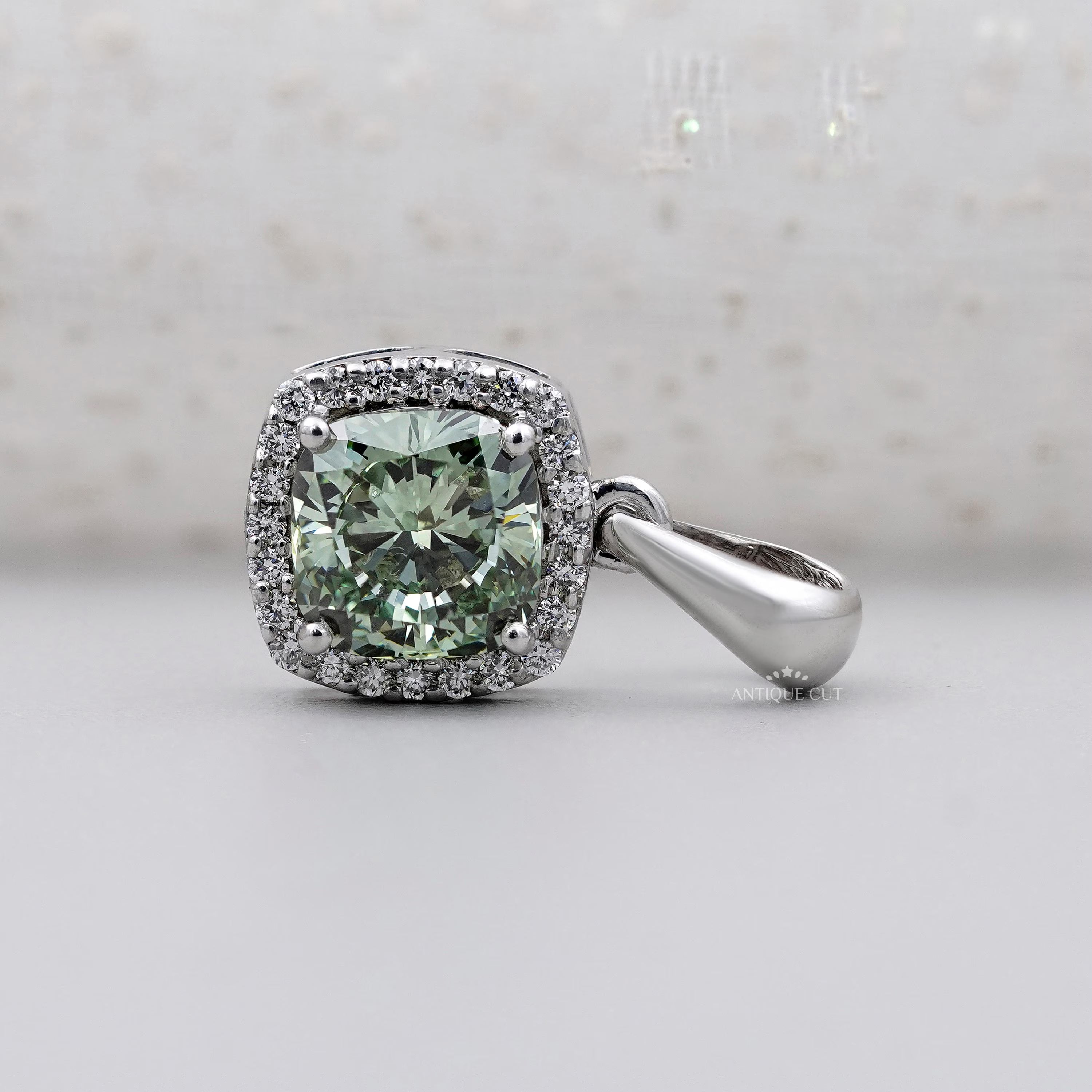 White gold green moissanite pendant with halo