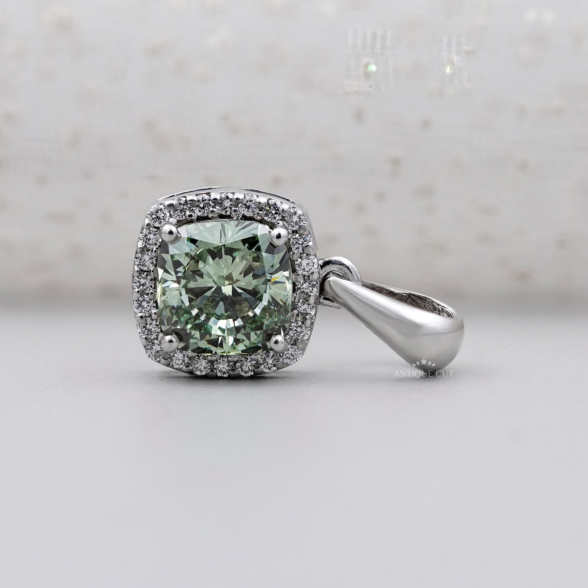 White gold green moissanite pendant with halo
