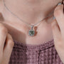 Statement cushion cut green pendant