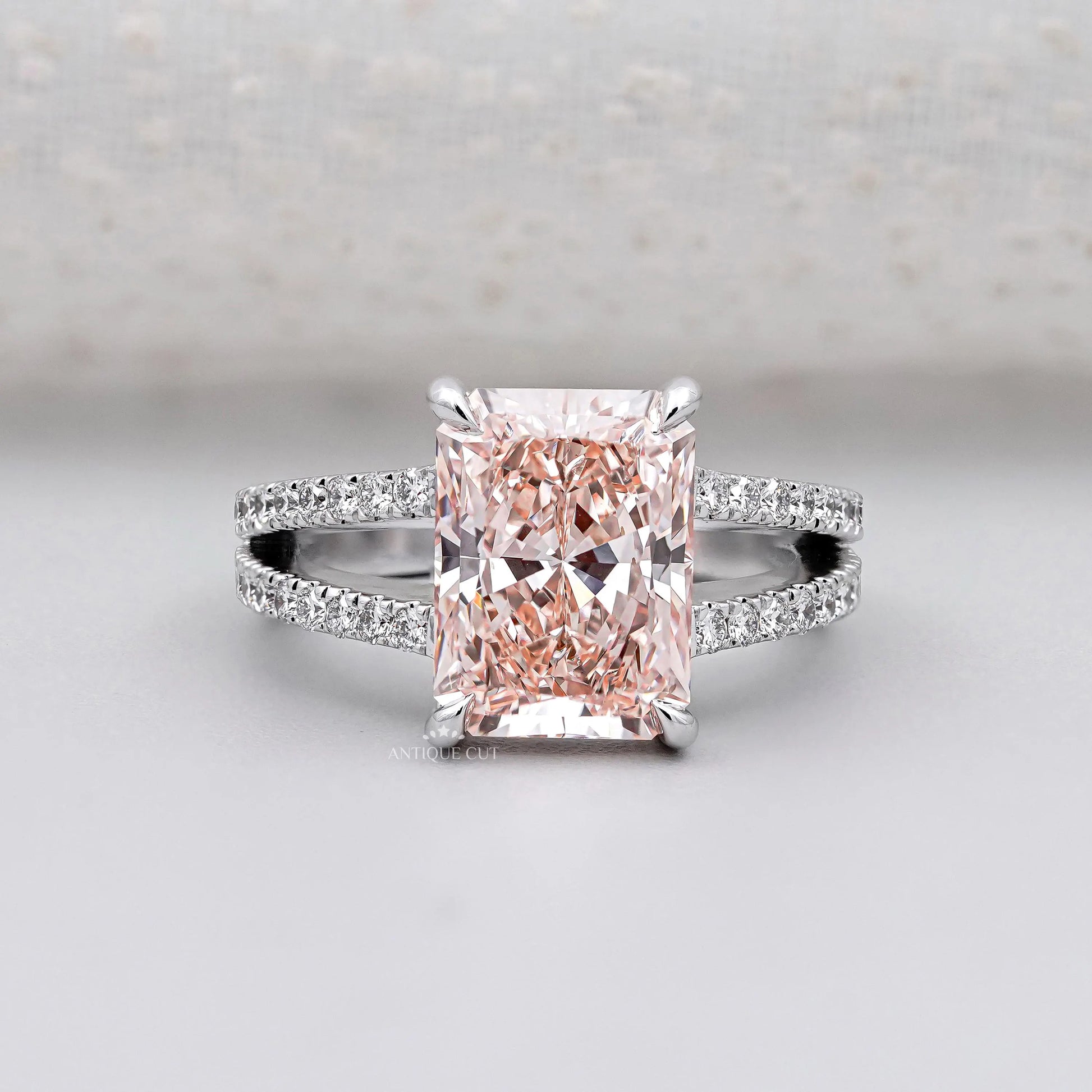 Radiant pink diamond split shank engagement ring in white gold