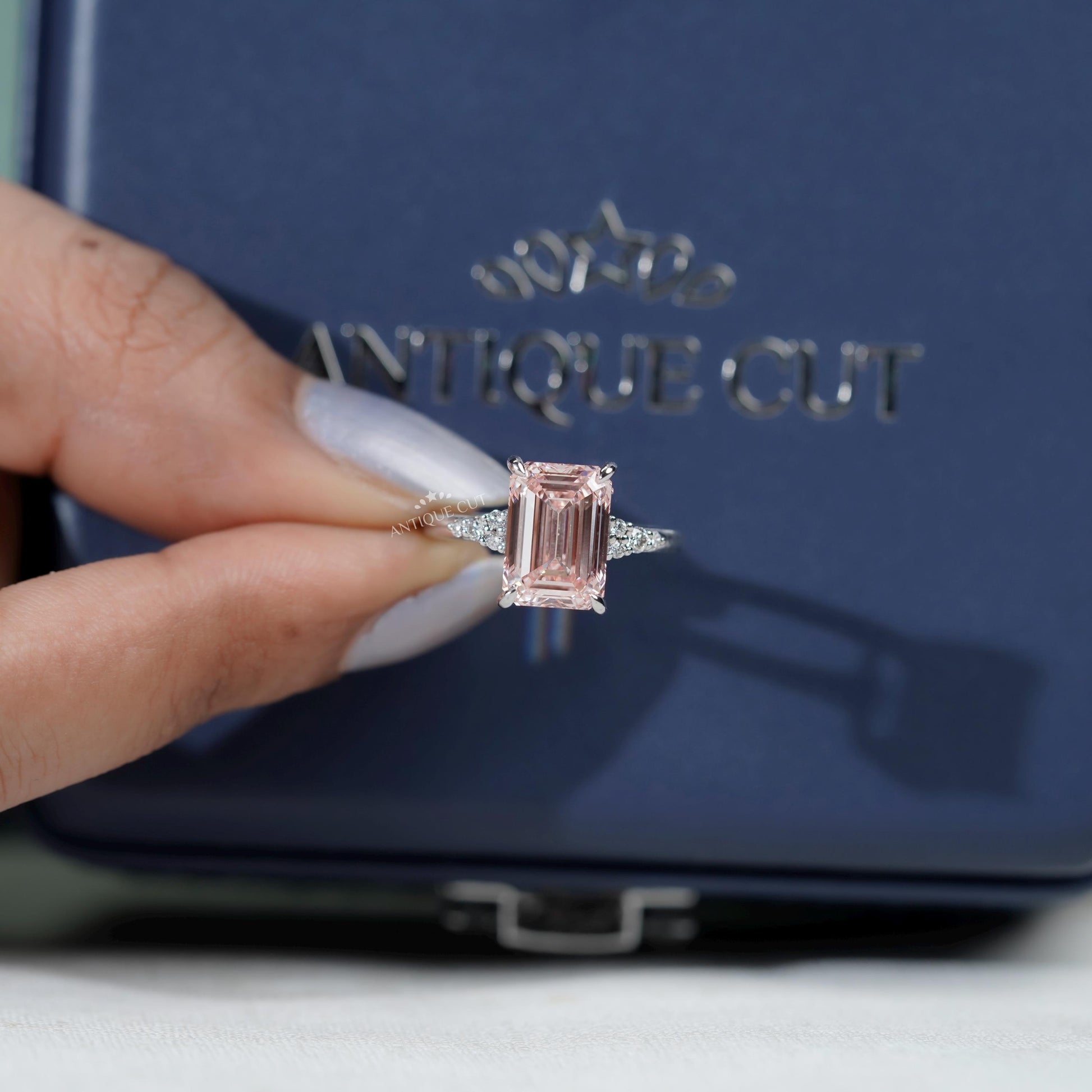 Timeless emerald cut pink diamond engagement ring