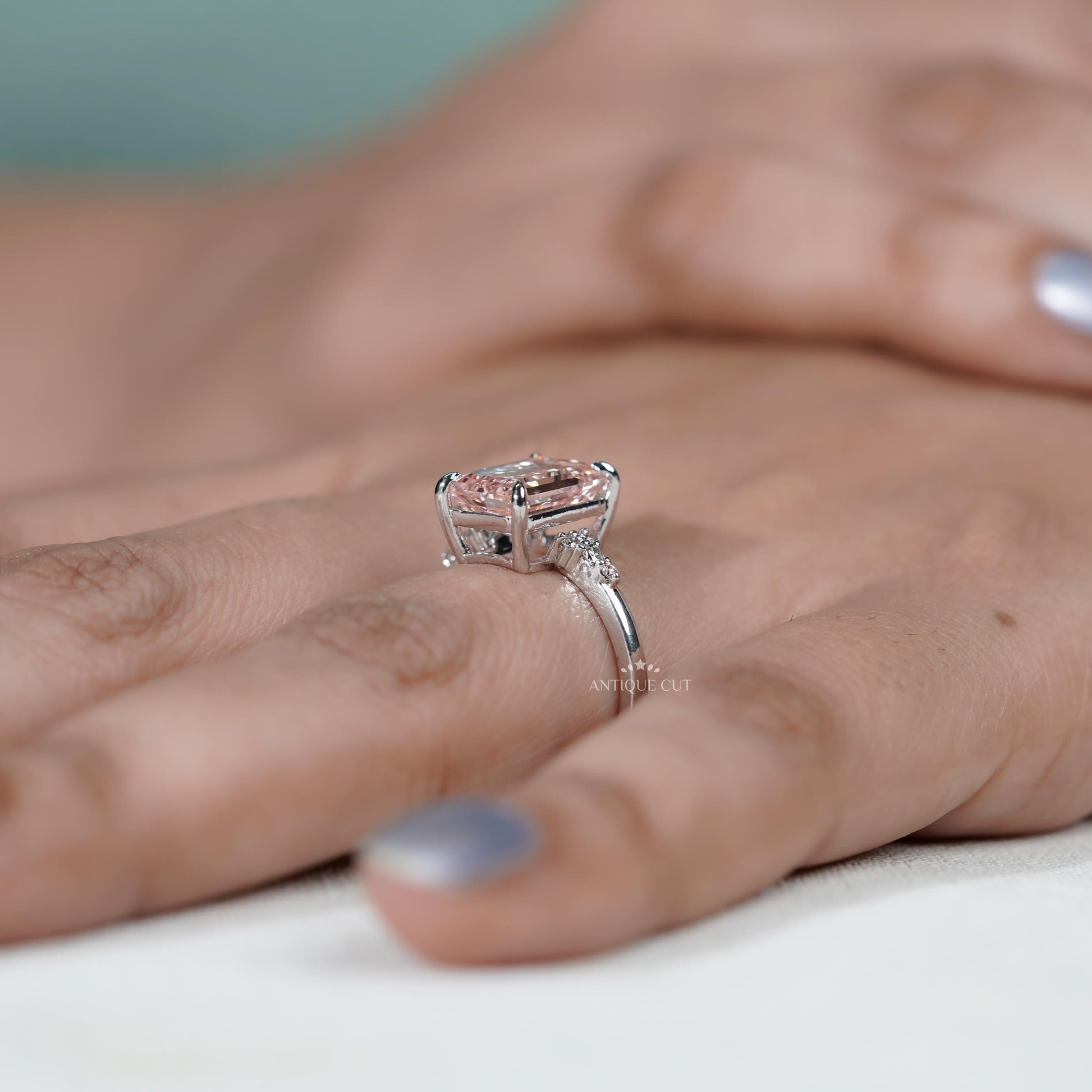 Elegant pink diamond ring with cluster accents