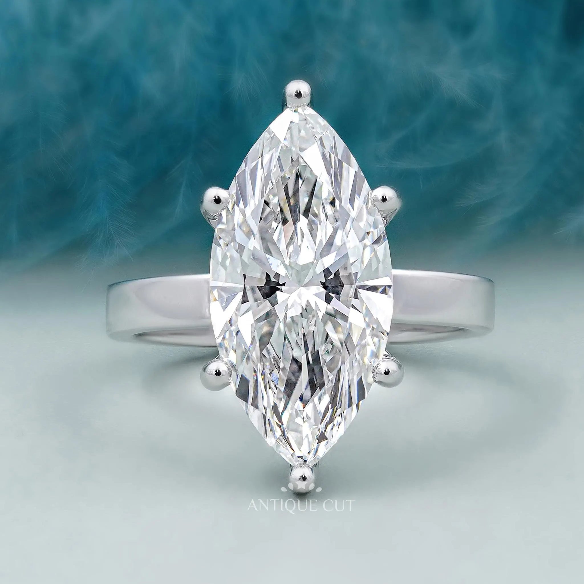 Marquise cut solitaire engagement ring in white gold