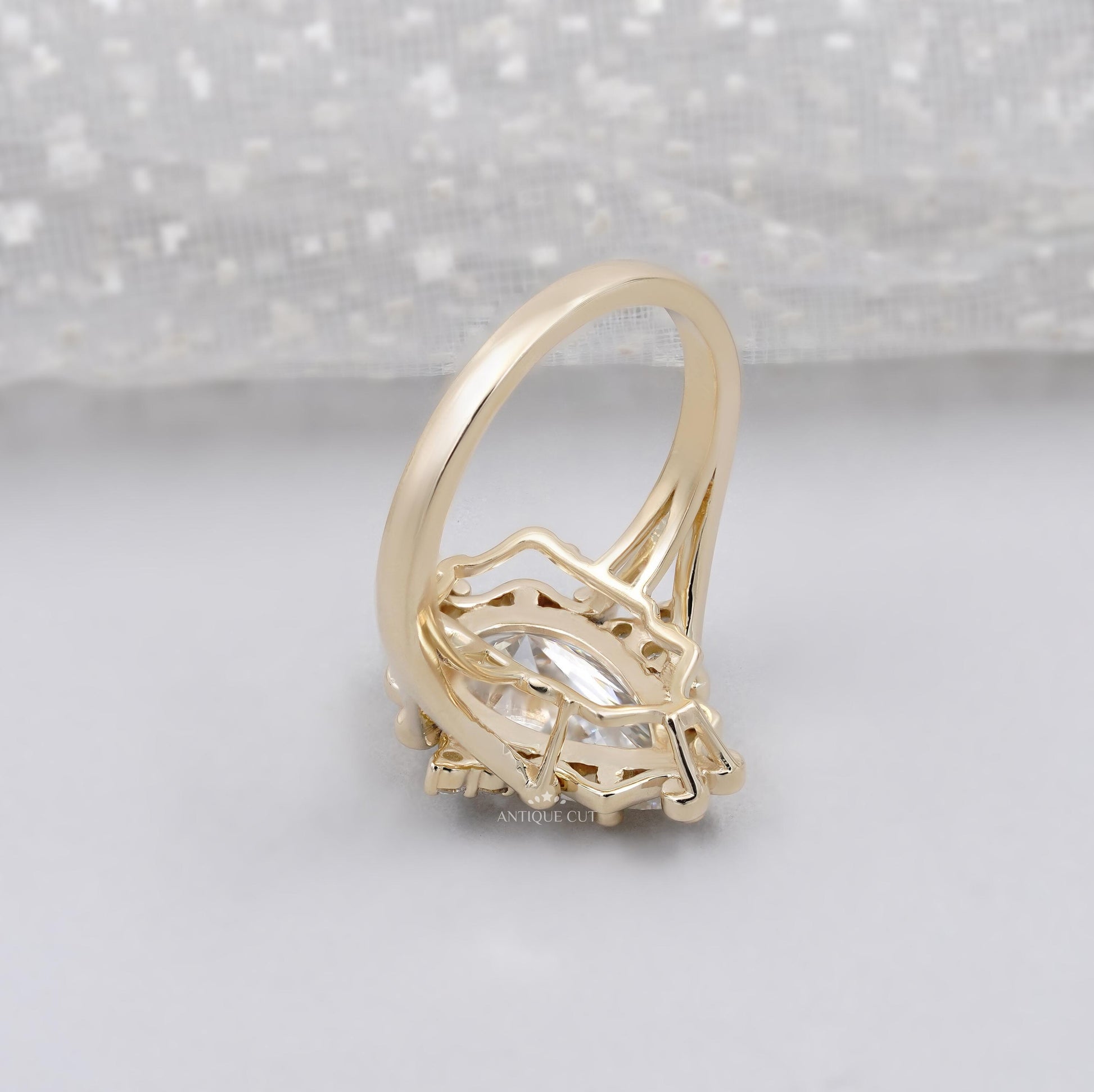 Elegant pear cut diamond ring with detailed gold setting