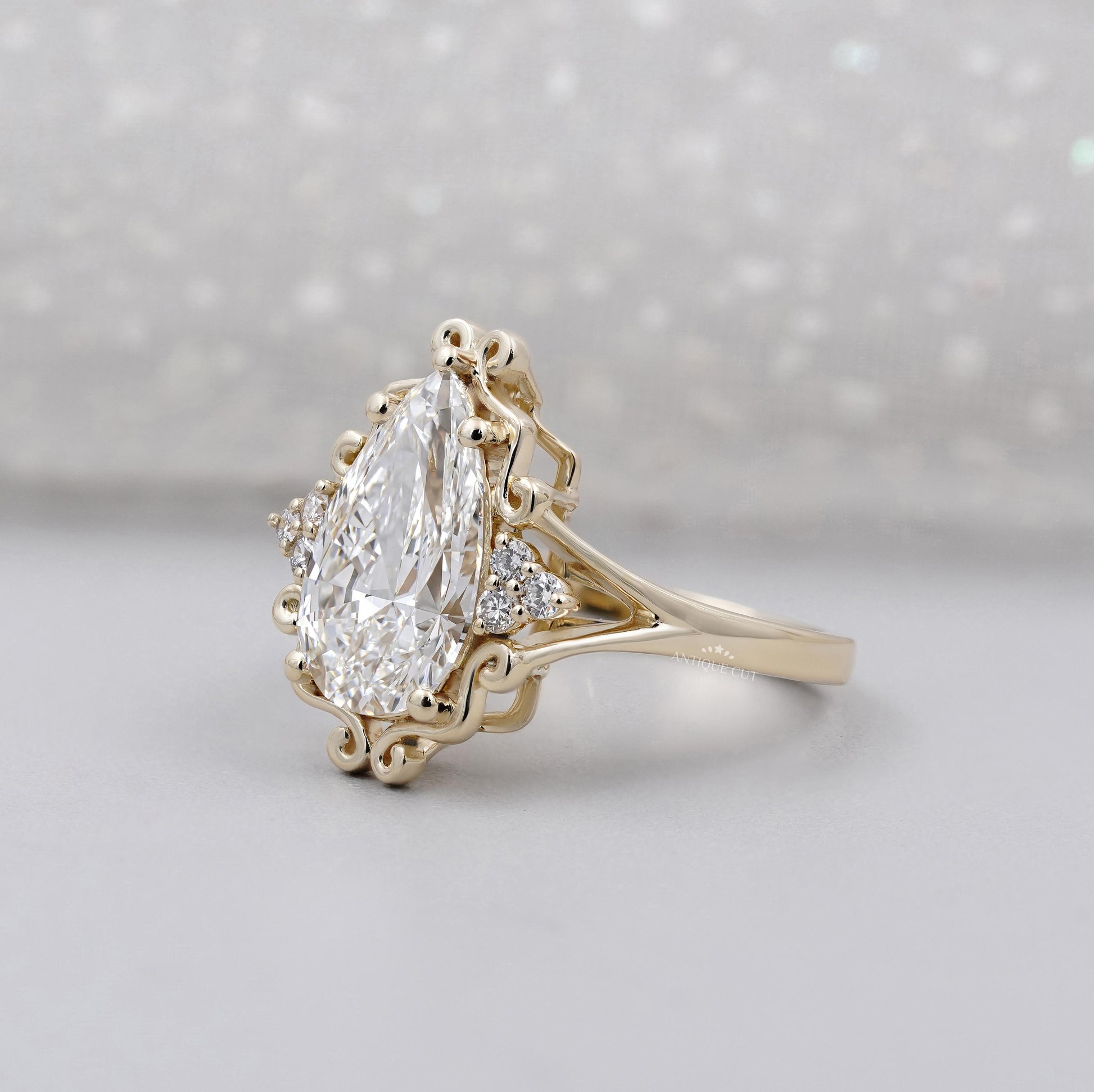 Yellow gold pear cut solitaire engagement ring