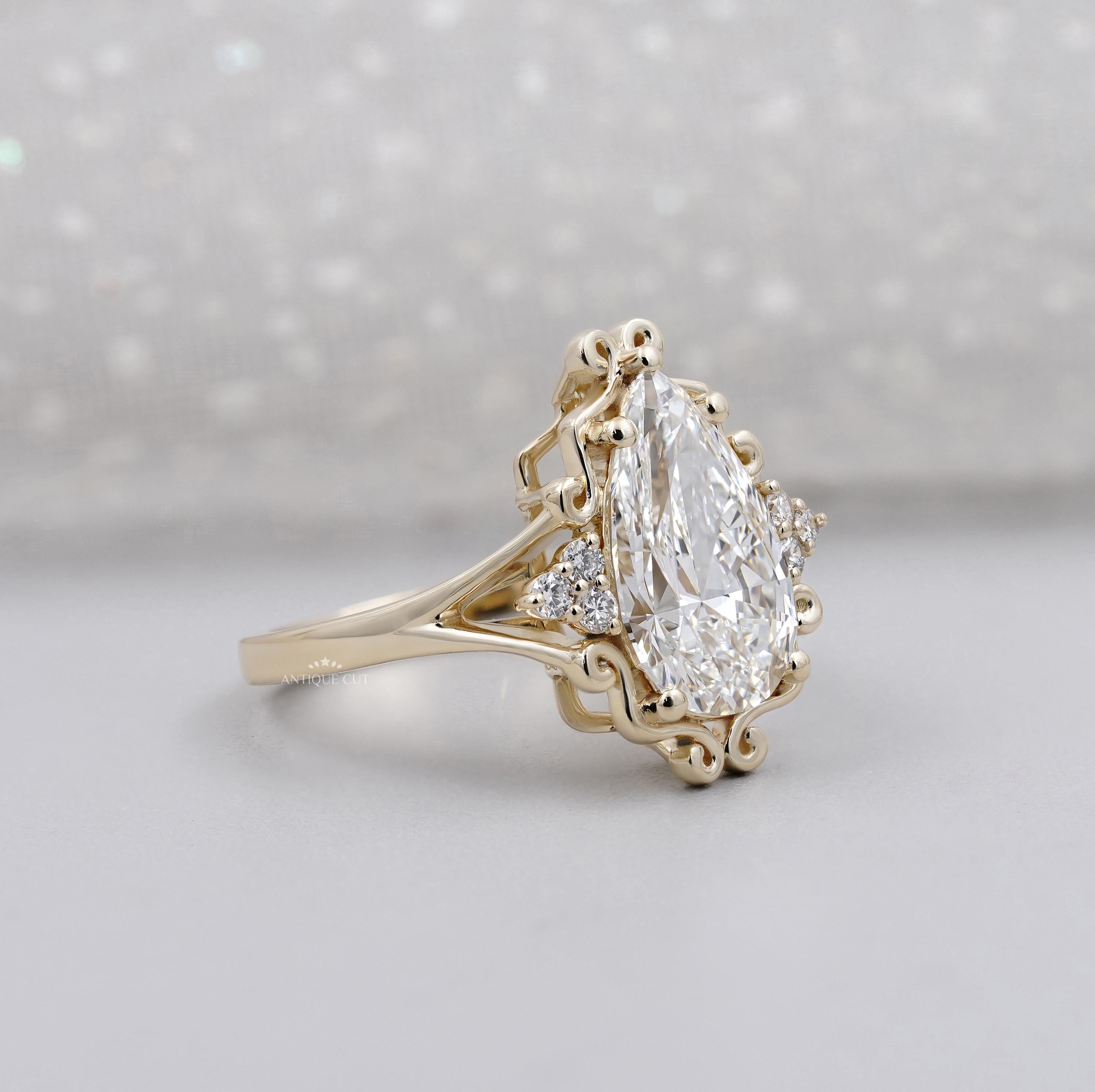 Unique pear shaped diamond engagement ring design