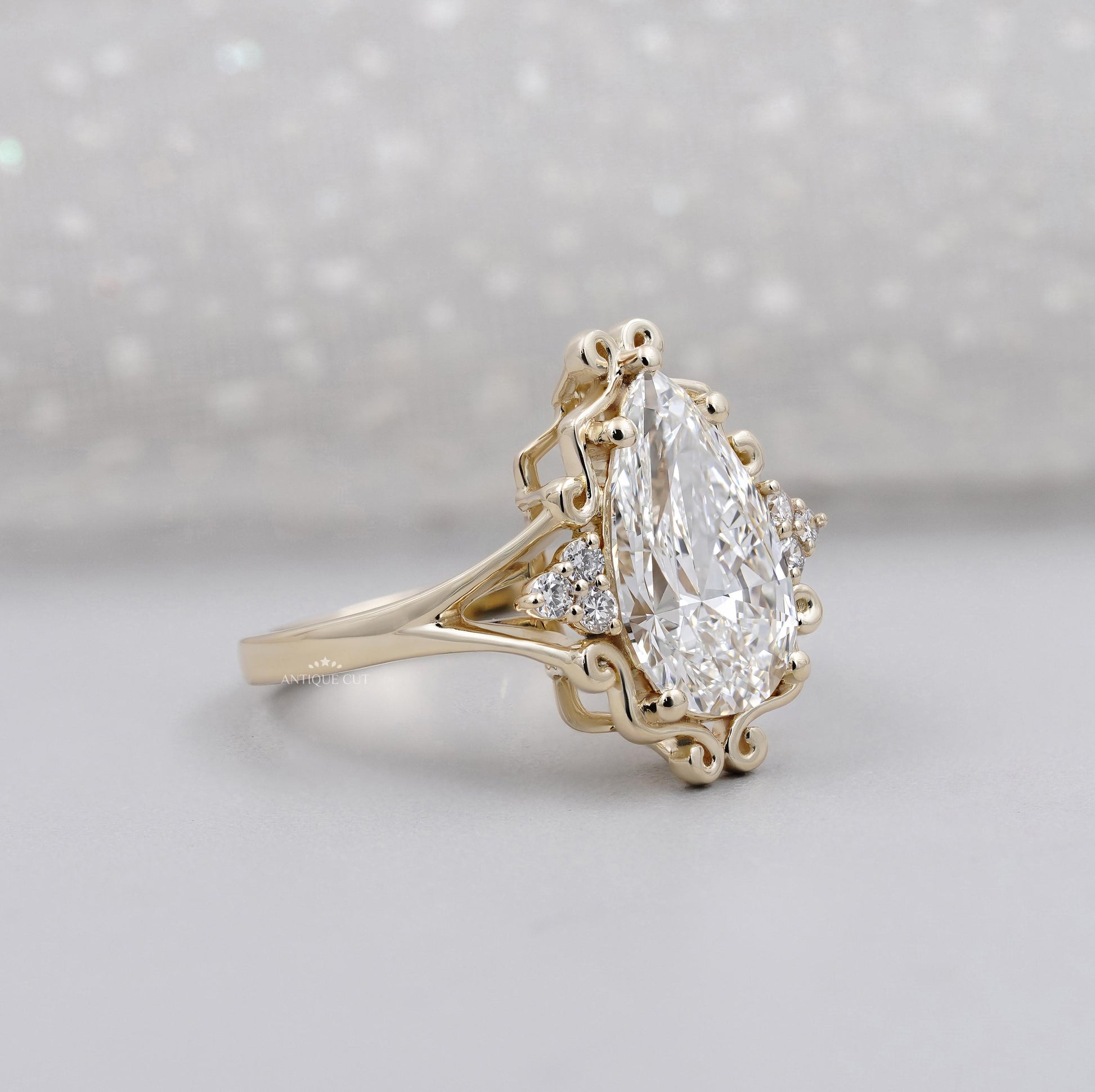 Unique pear shaped diamond engagement ring design