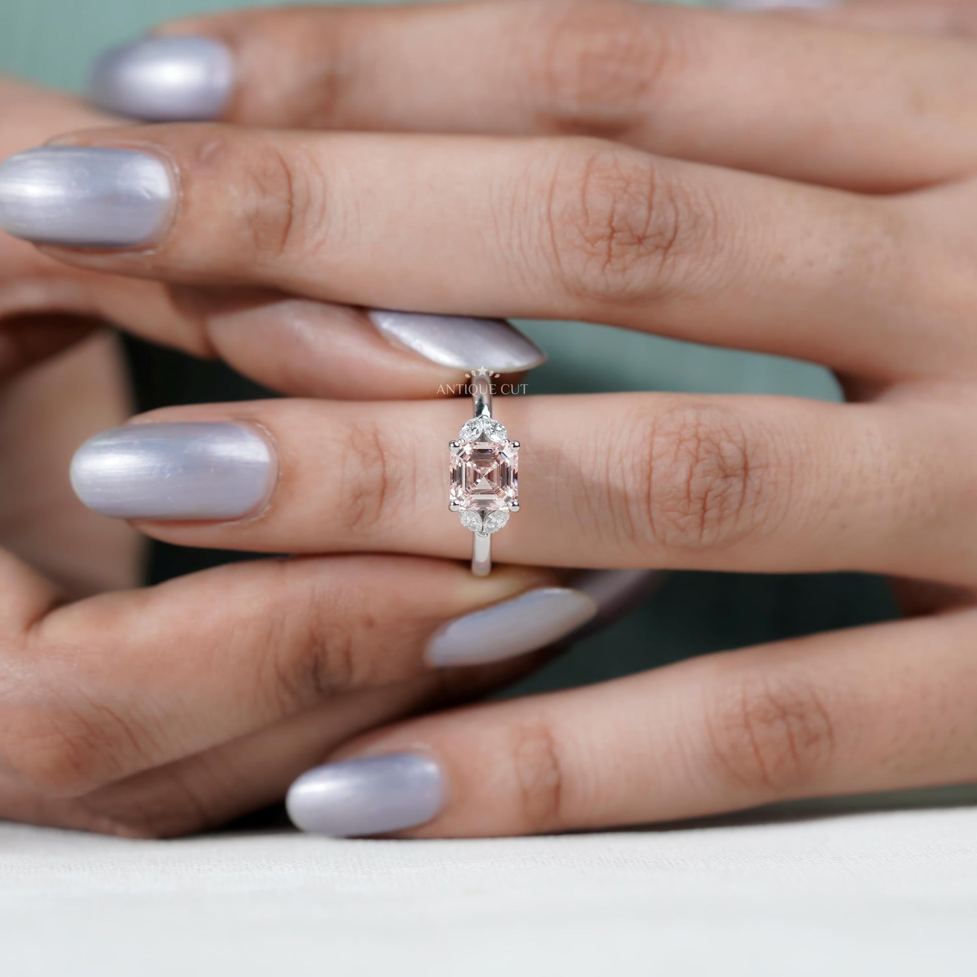 Luxury Asscher diamond ring with marquise side stones