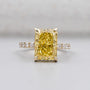 Radiant fancy yellow diamond engagement ring in yellow gold