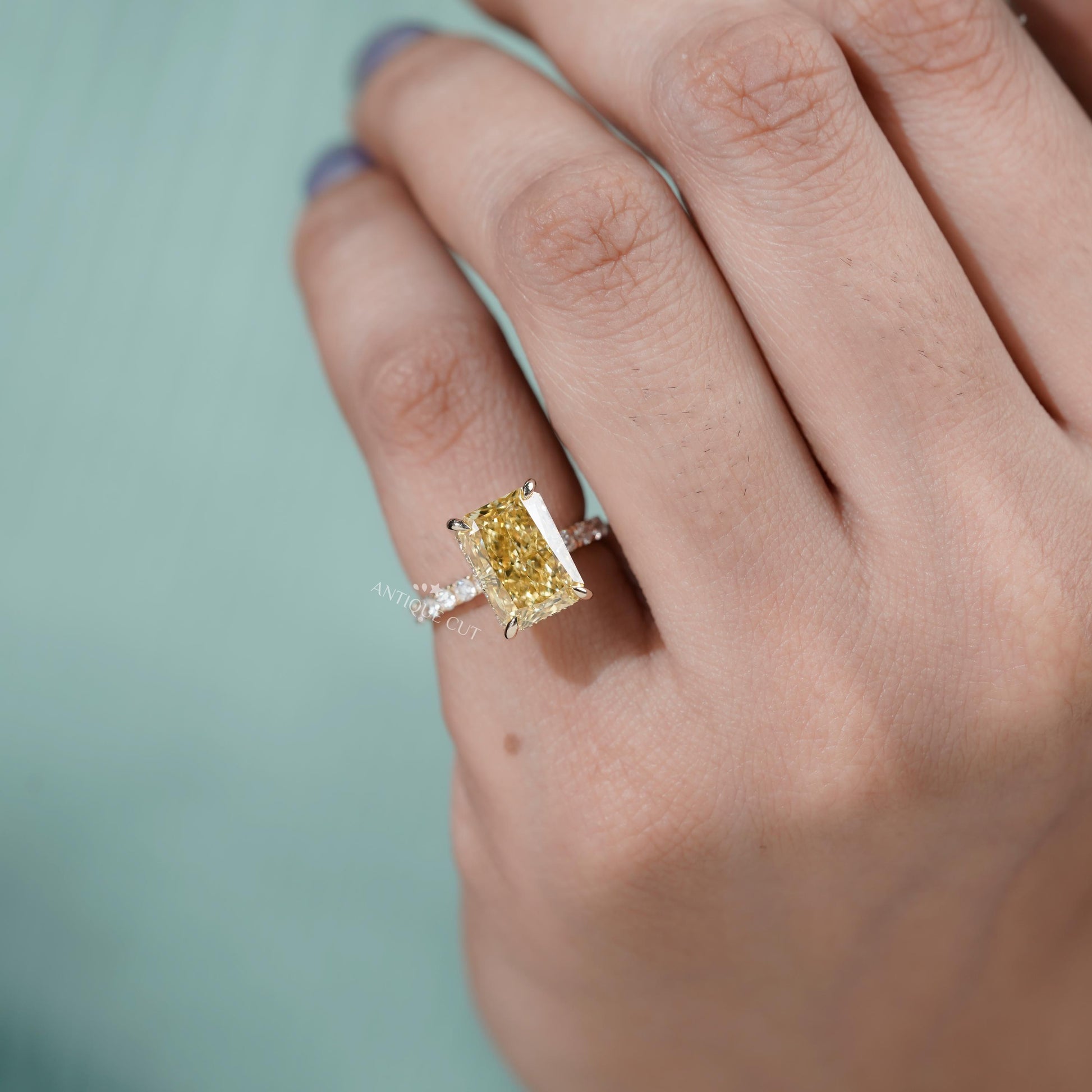 Luxury yellow gold yellow diamond ring with pave band