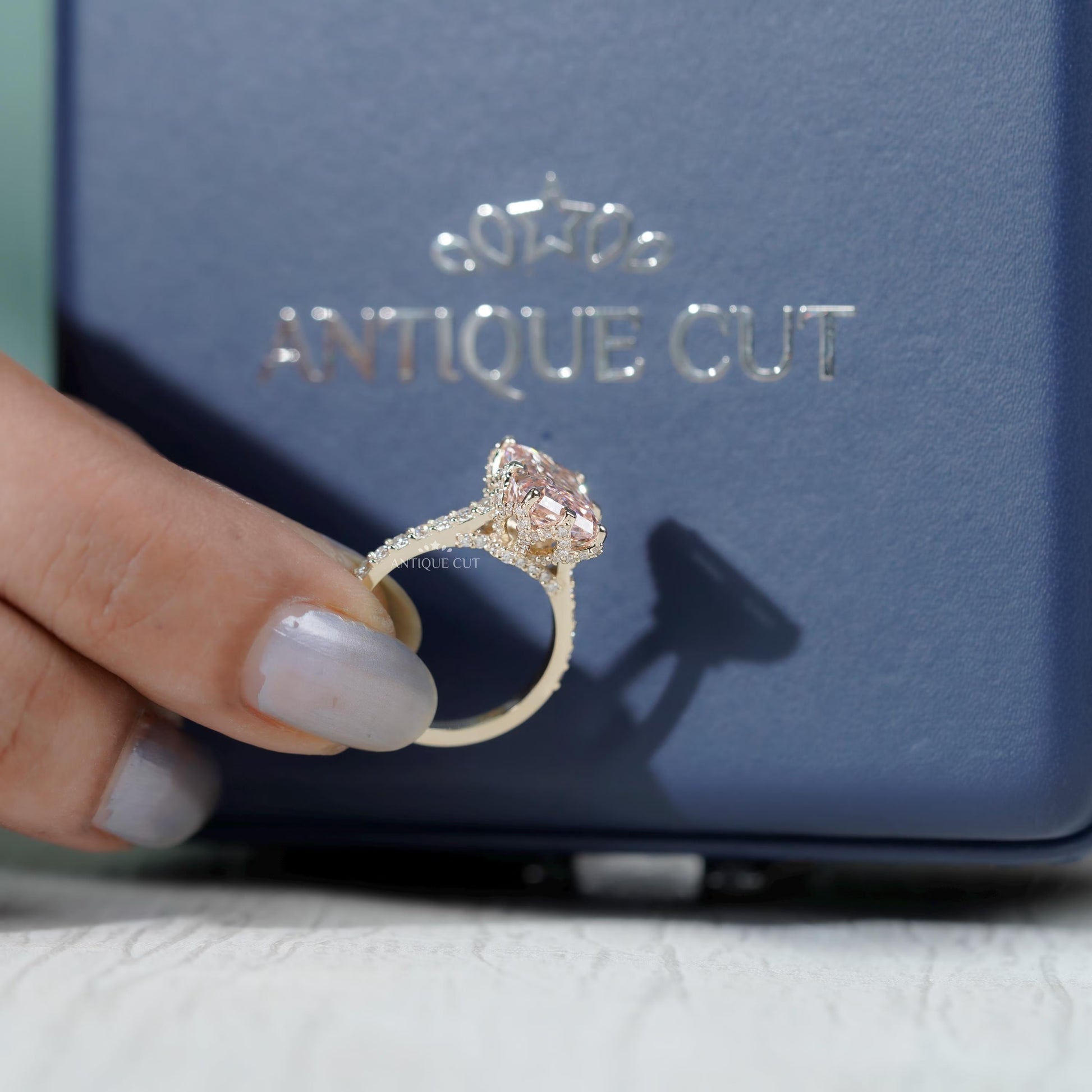 White gold and yellow gold radiant pink diamond ring