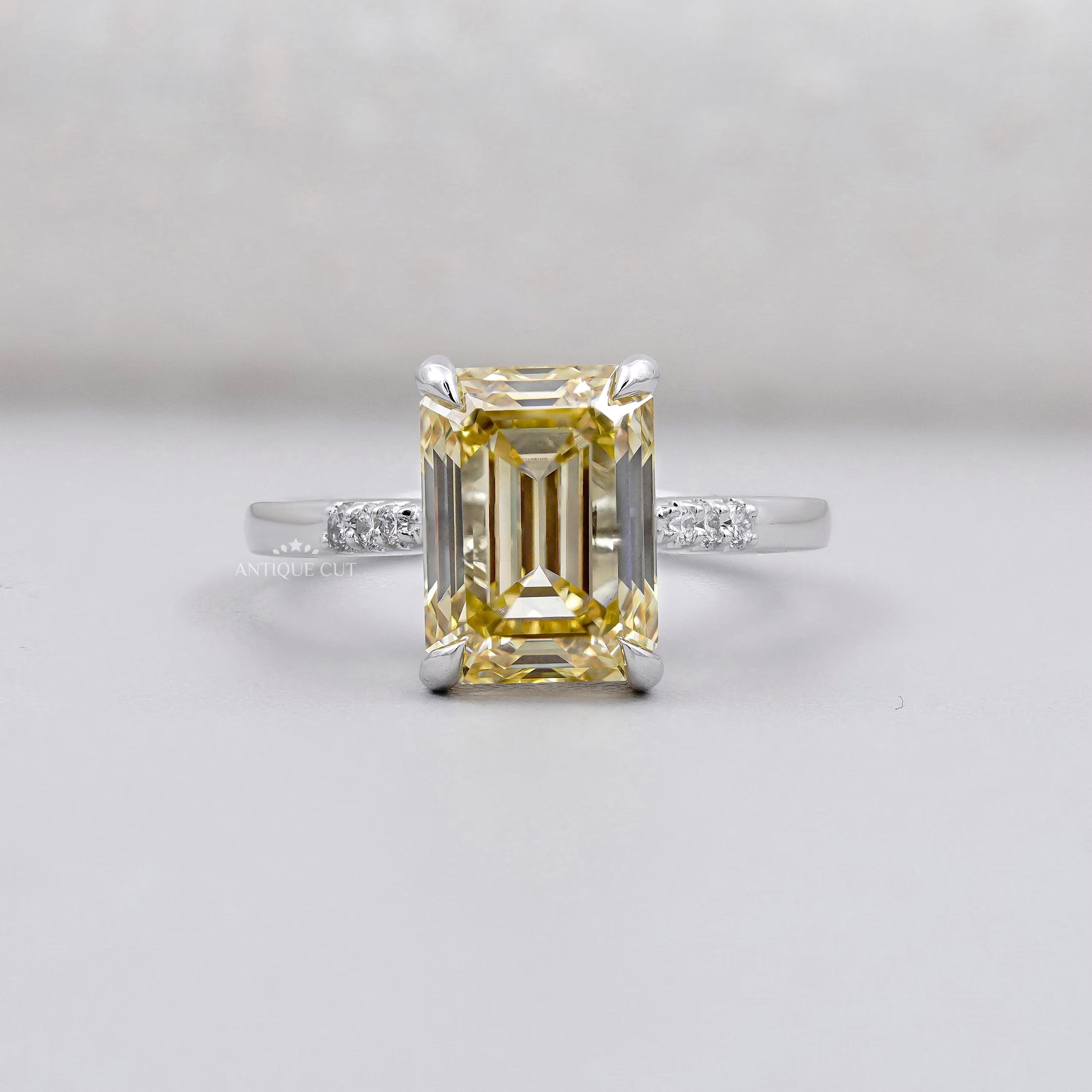 Emerald Cut Diamond Yellow Gold Engagement Ring With Side Stone IGI Certified