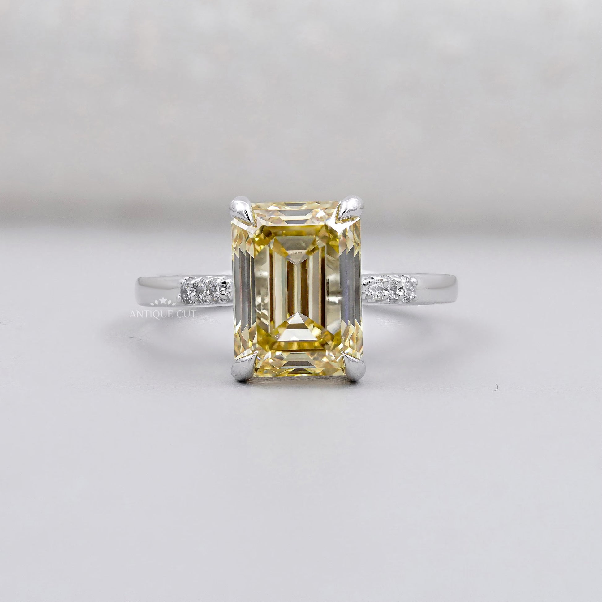 Emerald Cut Diamond Yellow Gold Engagement Ring With Side Stone IGI Certified