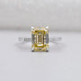 Emerald cut diamond engagement ring in white gold with side stones