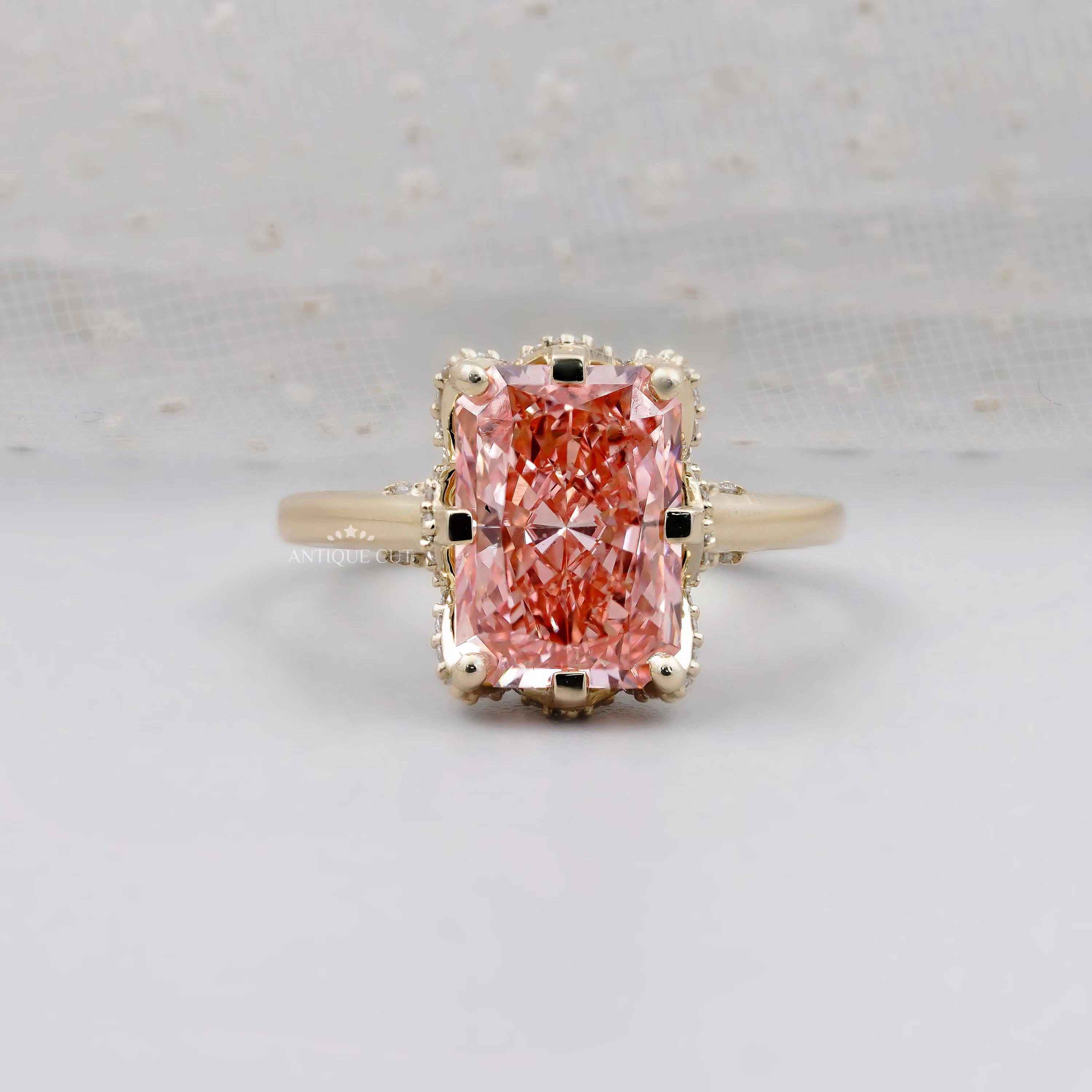 Radiant pink diamond hidden halo engagement ring in yellow gold